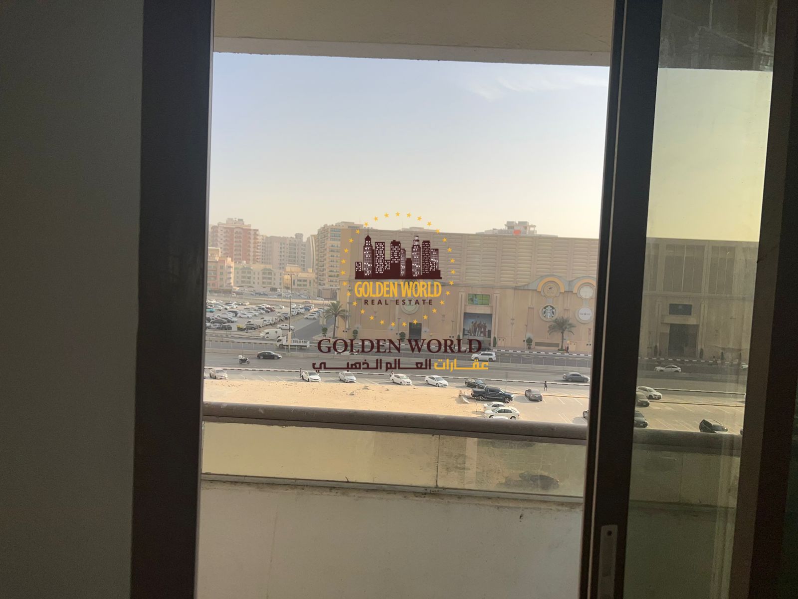 Spacious 3-bedroom apartment with a living room and parking, featuring a direct view of Sahara Centre in Al Nahda, Sharjah, offering large layouts, pr