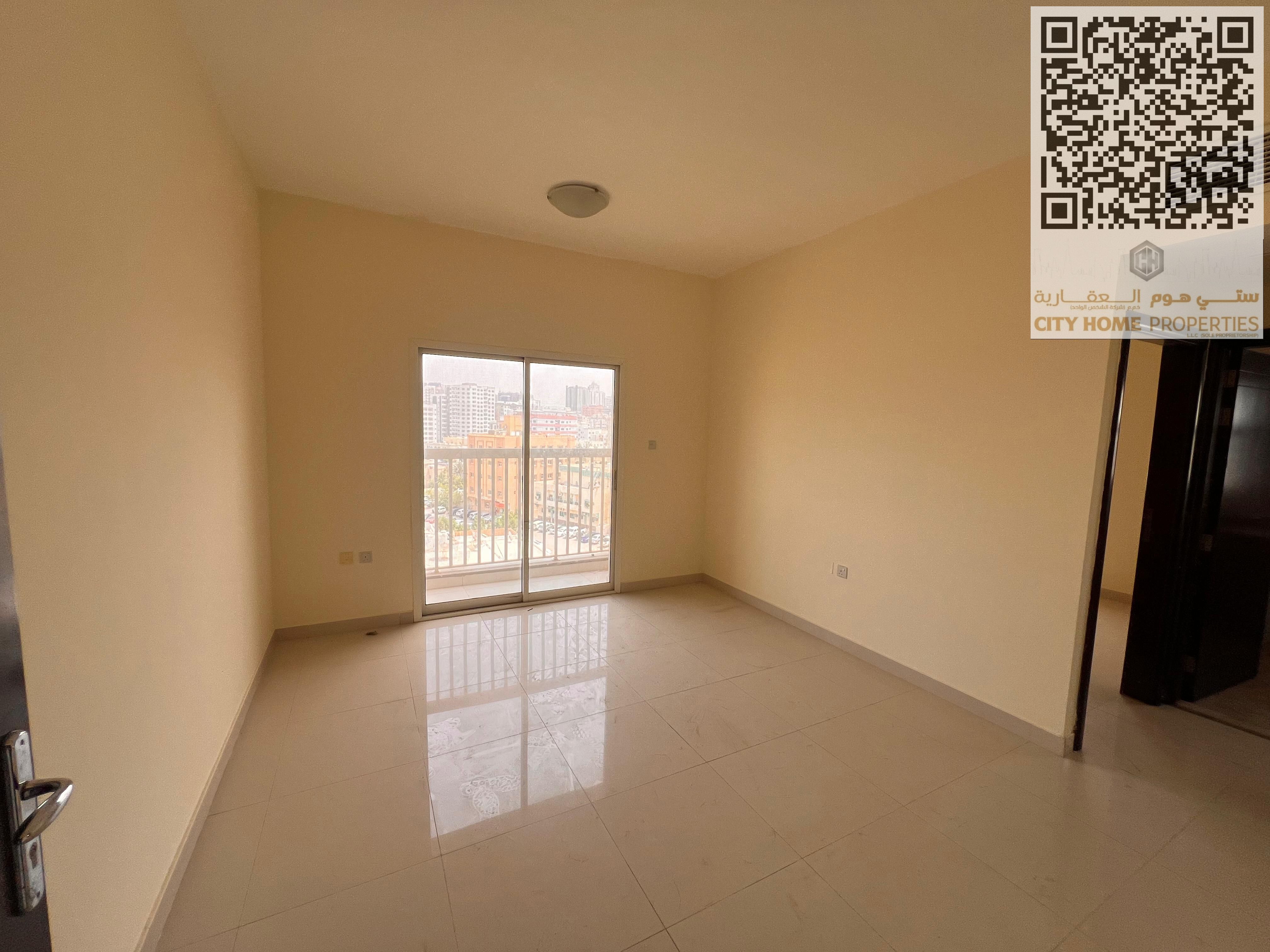 For Rent: 1-Bedroom Apartment with Spacious Living Room, Balcony with Open View, and Central Air Conditioning, Prime Location Behind Al Safeer Mall an