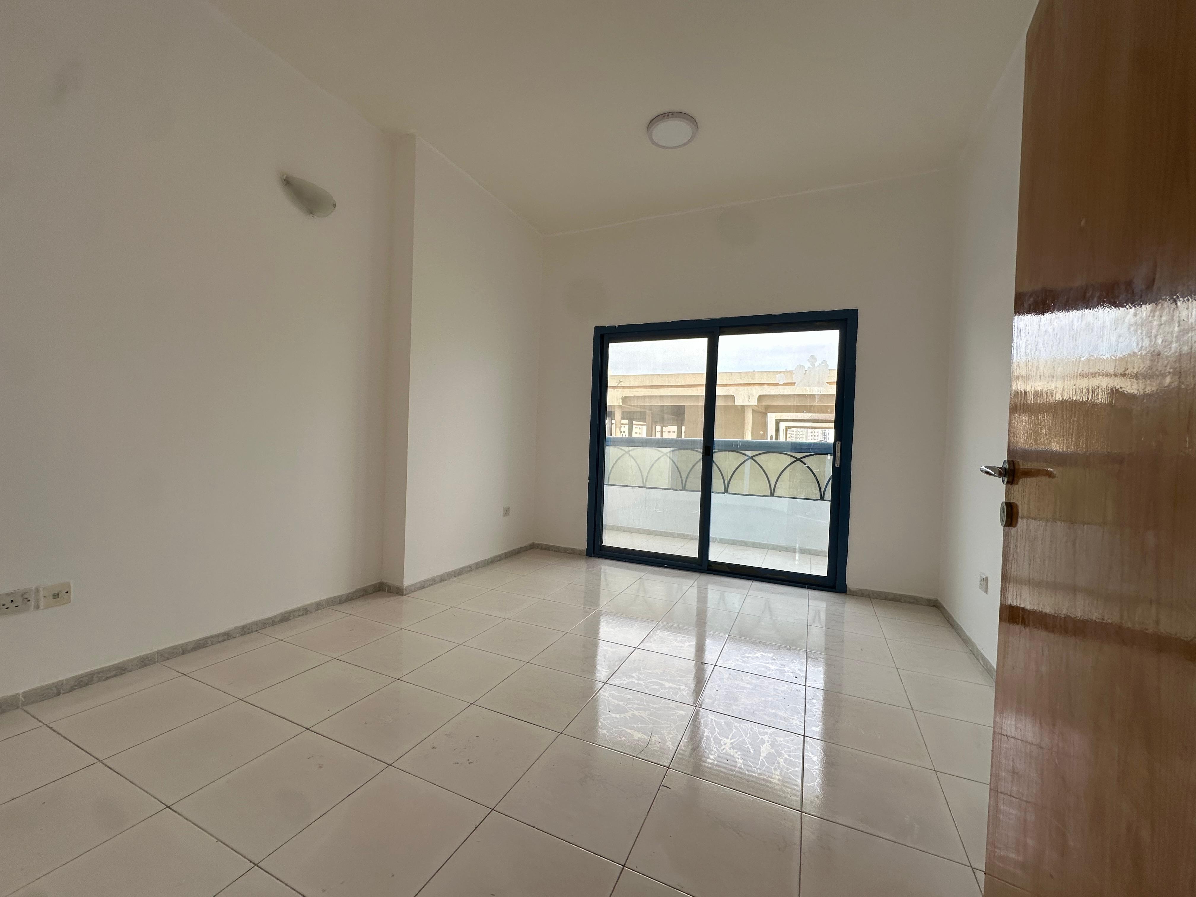 Spacious 2BR apartment in Al Majaz 1 with free AC, balcony, good finishing, and a prime location close to services. Rent: 46,000 AED.