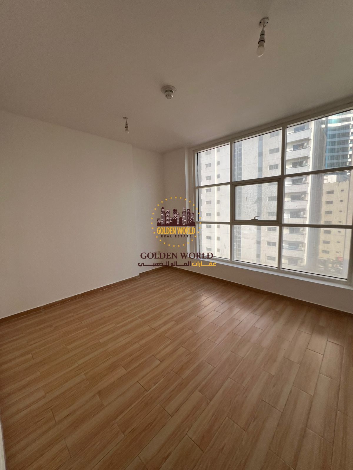 Two-bedroom apartment for annual rent in Sharjah Al Majaz 3 with balcony, gym, swimming pool, free parking, free maintenance, and a prime location clo