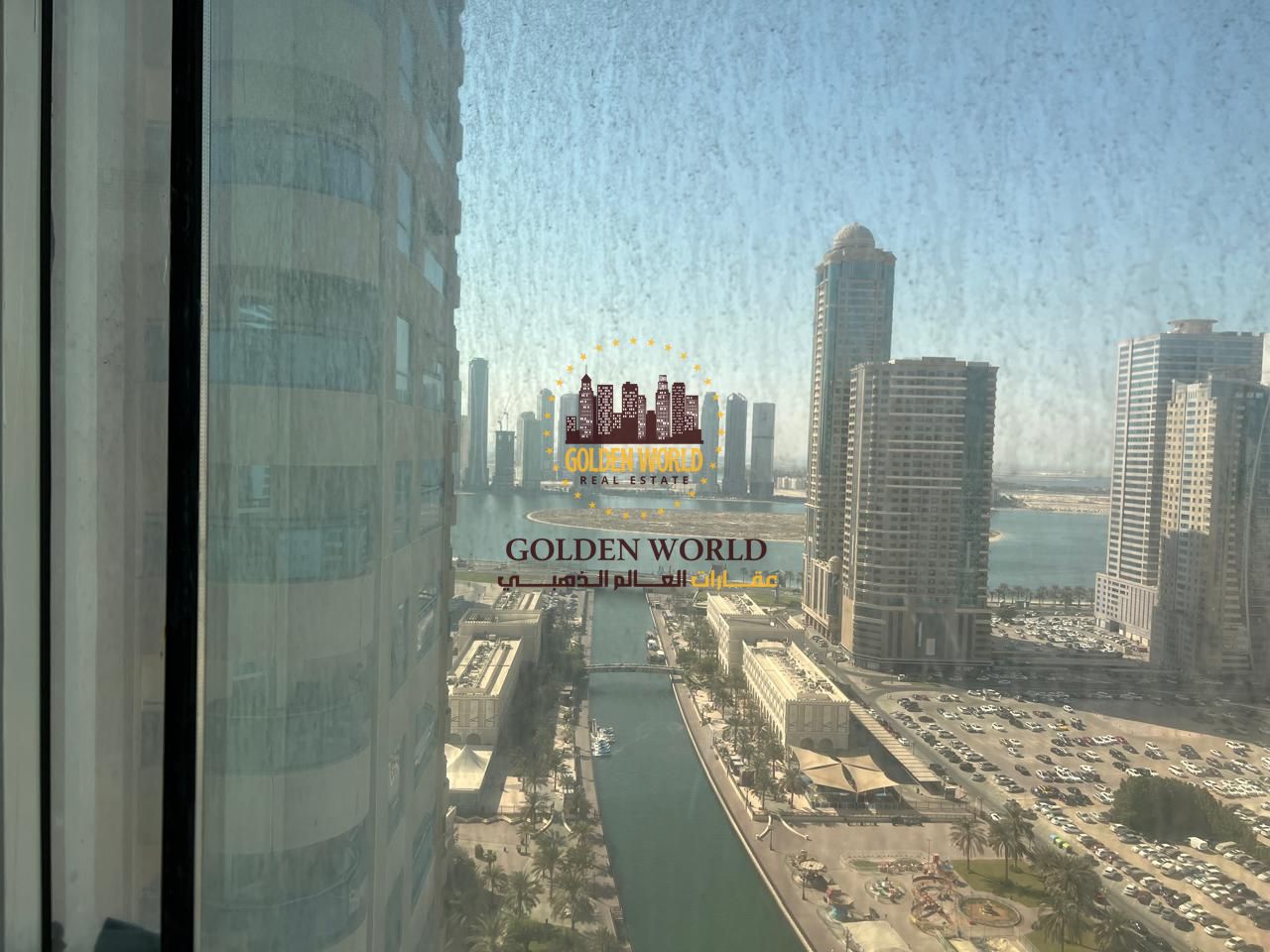 Two-bedroom apartment with living room for annual rent in Sharjah Al Majaz 3, balcony, free parking, central AC, free maintenance, prime location, spe
