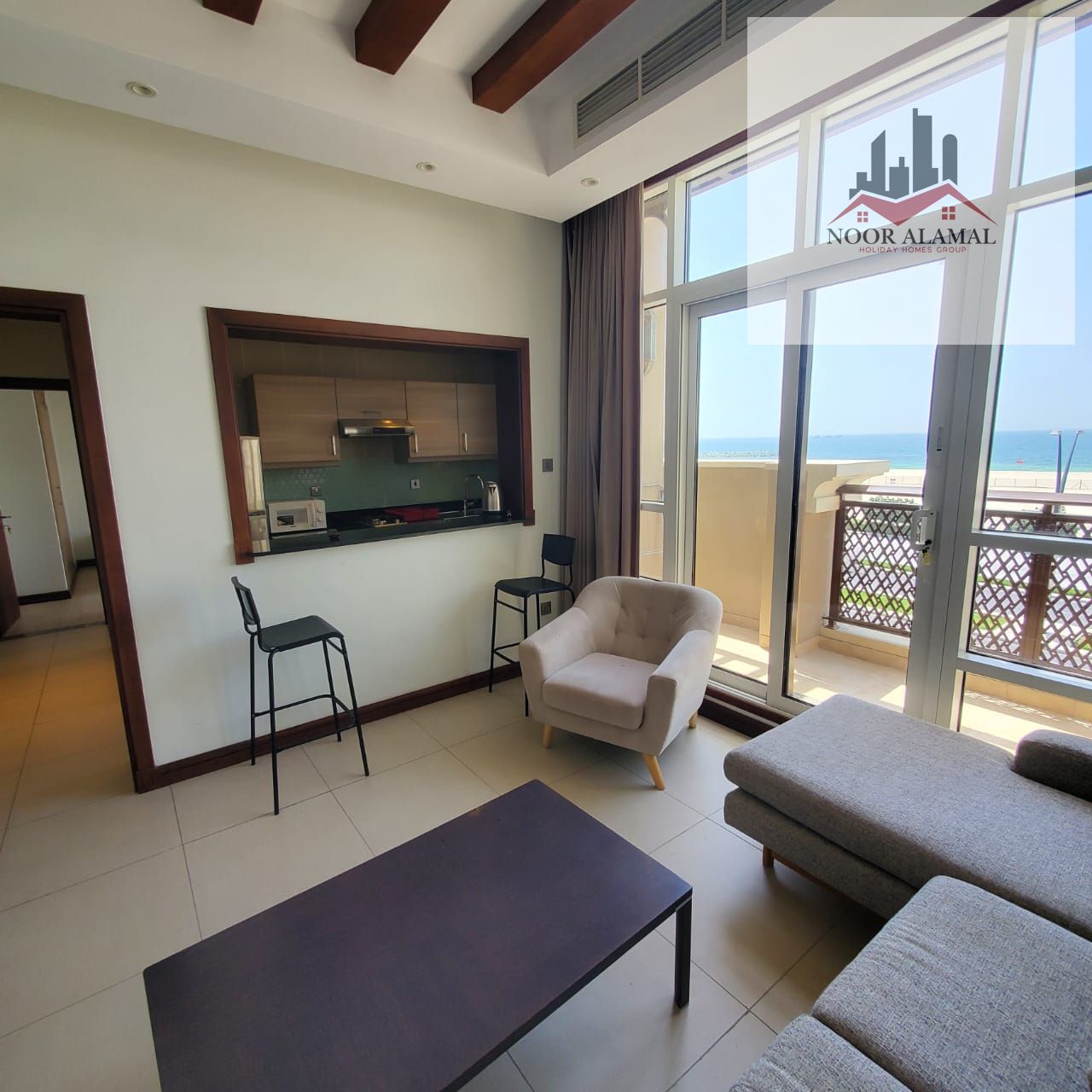 Sharjah - alriffa- alheera beach - one bedroom apartment with a living room, kitchen, and two bathrooms