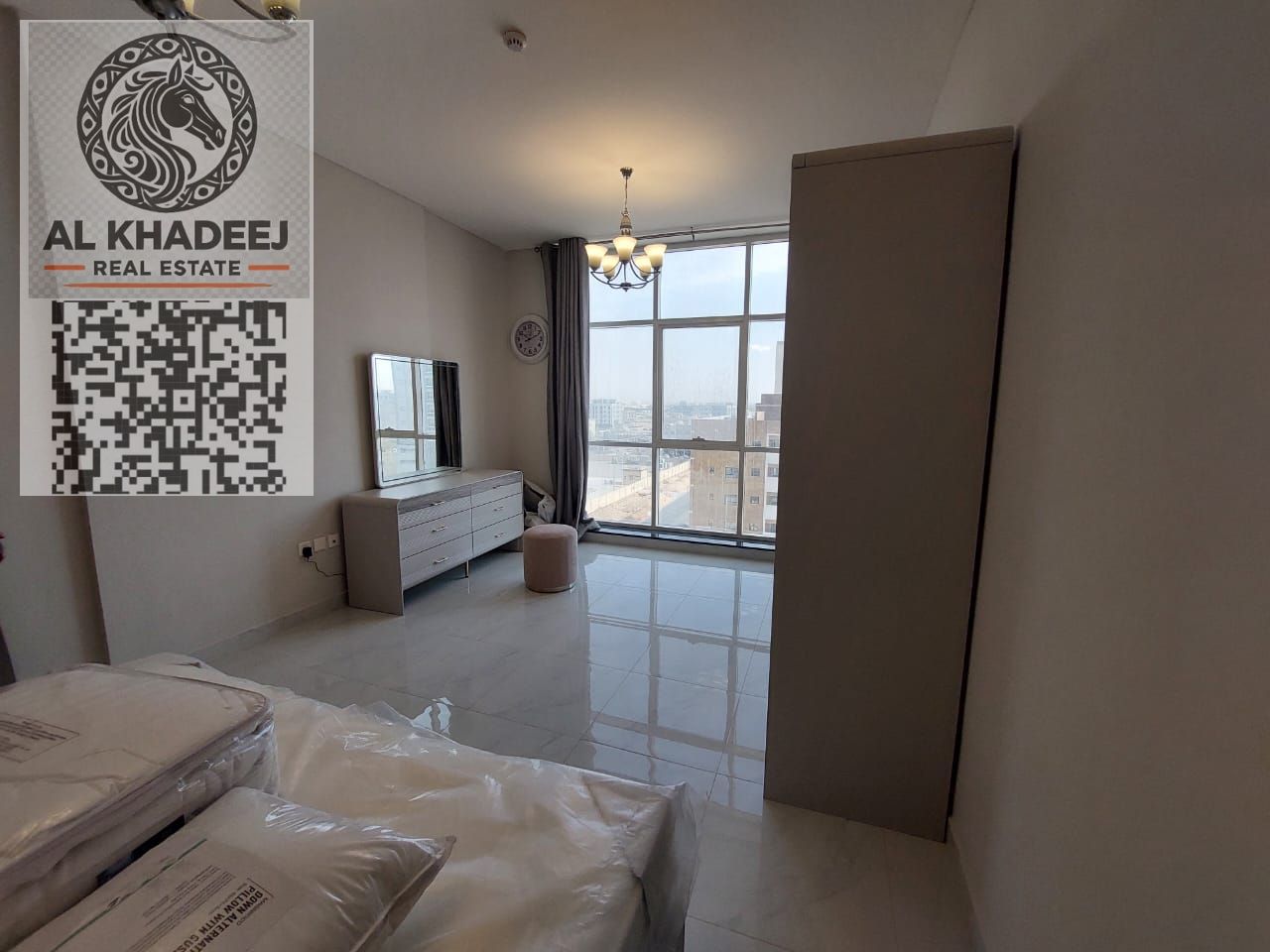 2-bedroom apartment with spacious hall for annual rent in Al Jurf 3, Ajman. Large kitchen, 2 bathrooms, balcony, central AC, indoor parking.