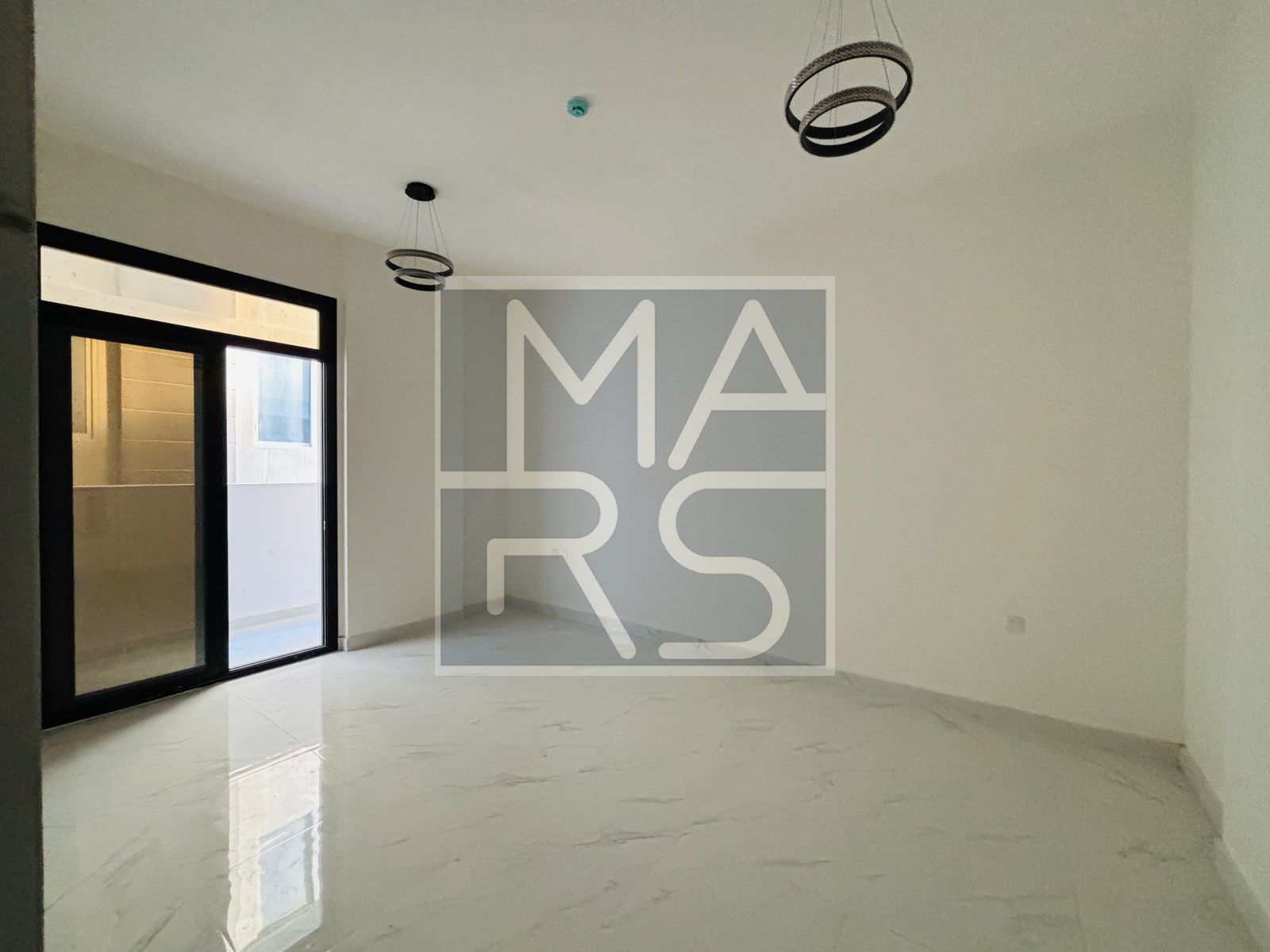One bedroom, living room, and balcony in Al Falah area, first occupancy west of Sharjah Airport. Price: 45,000 AED, payable in 4 small installments of