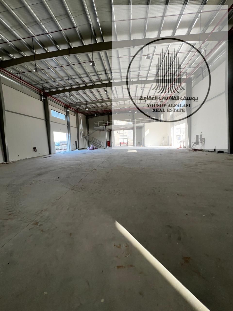 "Warehouse for rent in Umm Al Quwain on main road, 25,000 sqft, 260kW power, heavy duty flooring, ready for immediate use, annual rent AED 1,000,000. "