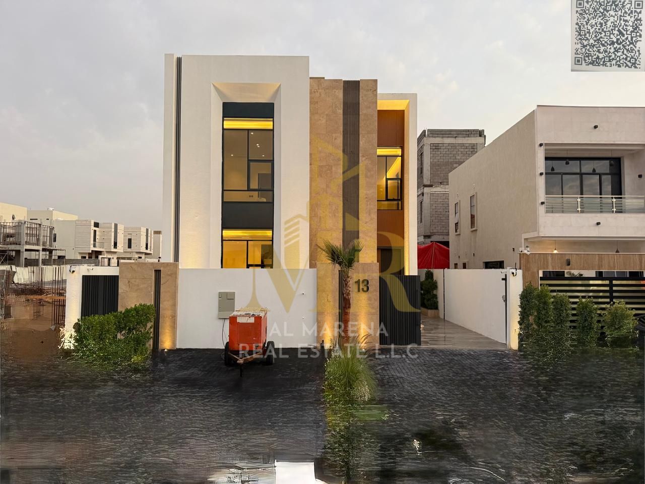 Your dream villa, including registration and ownership fees, two floors and a rooftop, at an attractive price, close to Sheikh Mohammed Bin Zayed Road