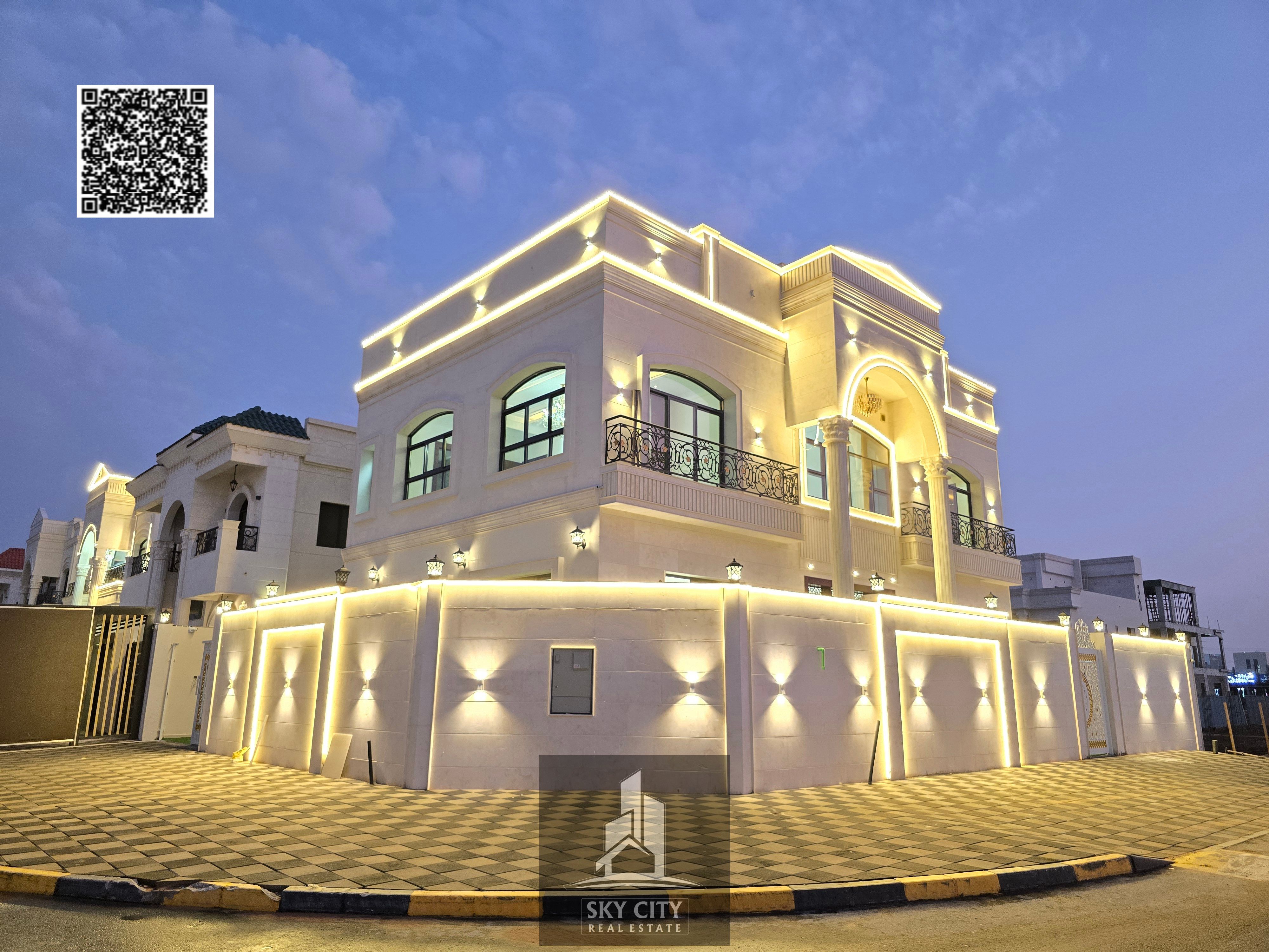 Villa for sale, corner lot on two streets, opposite Al Hamidiya Park and on Sheikh Khalifa Street, behind the petrol station and McDonald's.