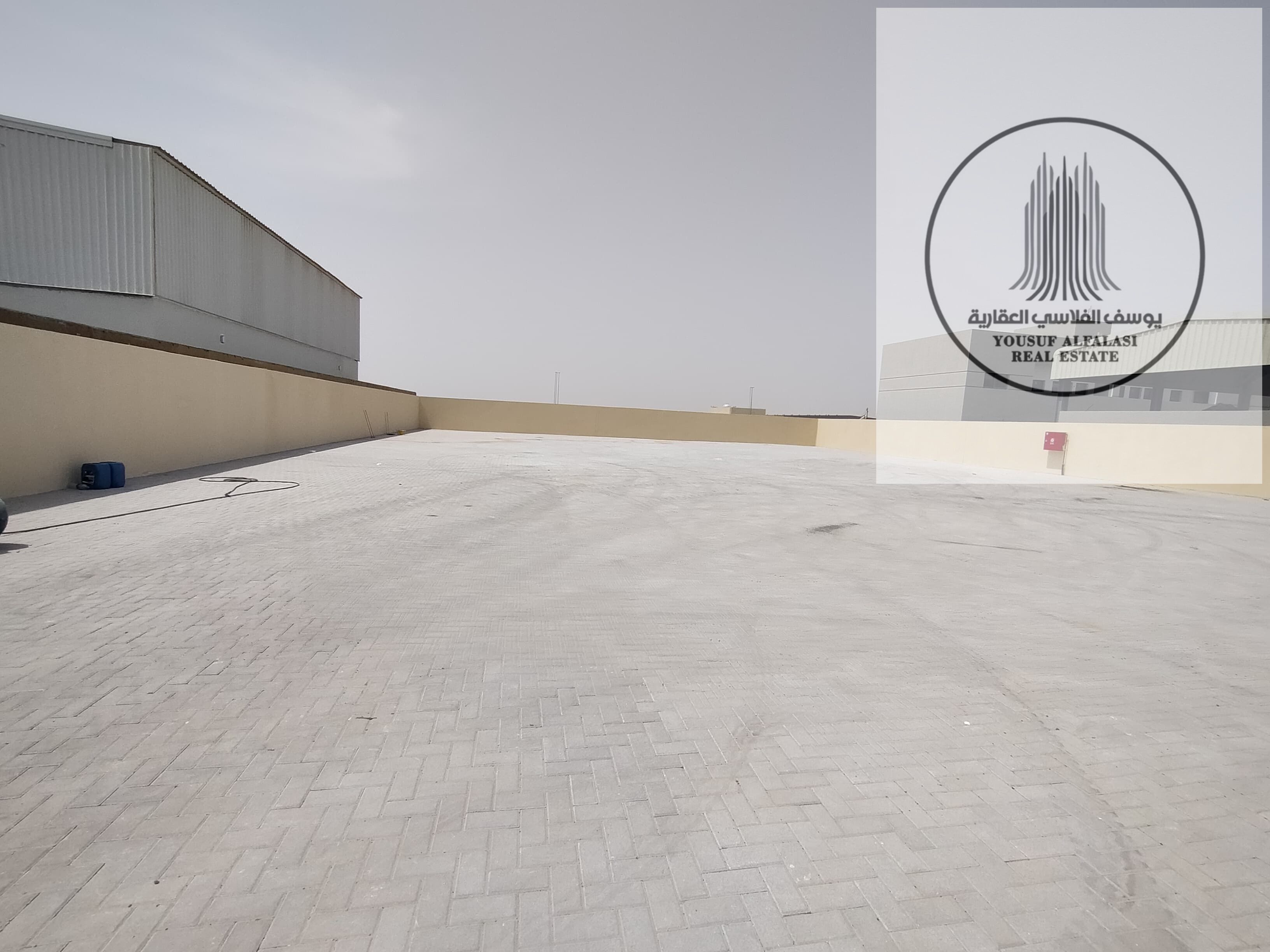 Al Sajaa Industrial Yard for rent 18,000 sq 62 KVA electricity price AED 350,000