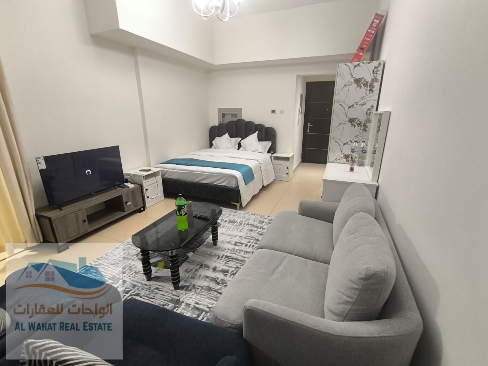 Furnished studio apartment for monthly rent, separate kitchen with balcony, in Al Yasmin Towers, next to City Centre Ajman.