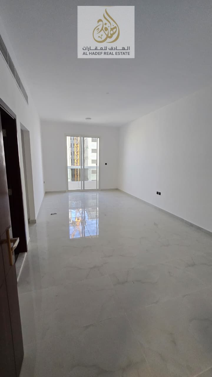 Annual rent in Ajman, Al Jurf 2 area, near the school complex. Two-bedroom apartment with a living room, central air conditioning, three bathrooms, ma