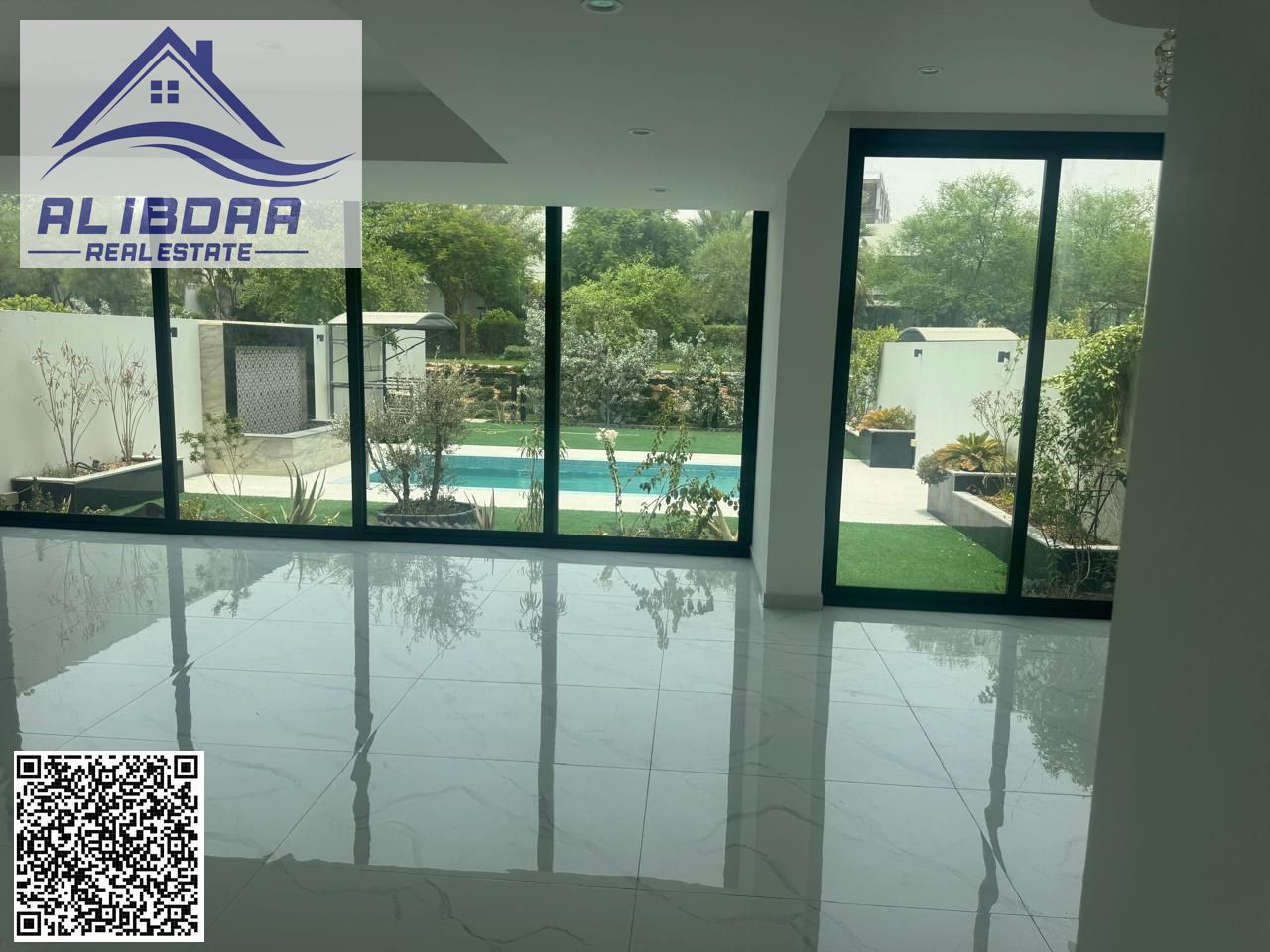 Luxury villa with a spacious area and swimming pool for sale in Al Zorah area