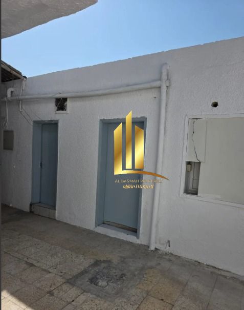 Corner house for sale in Al Hazana area, Sharjah, in a prime location suitable for living or investment.