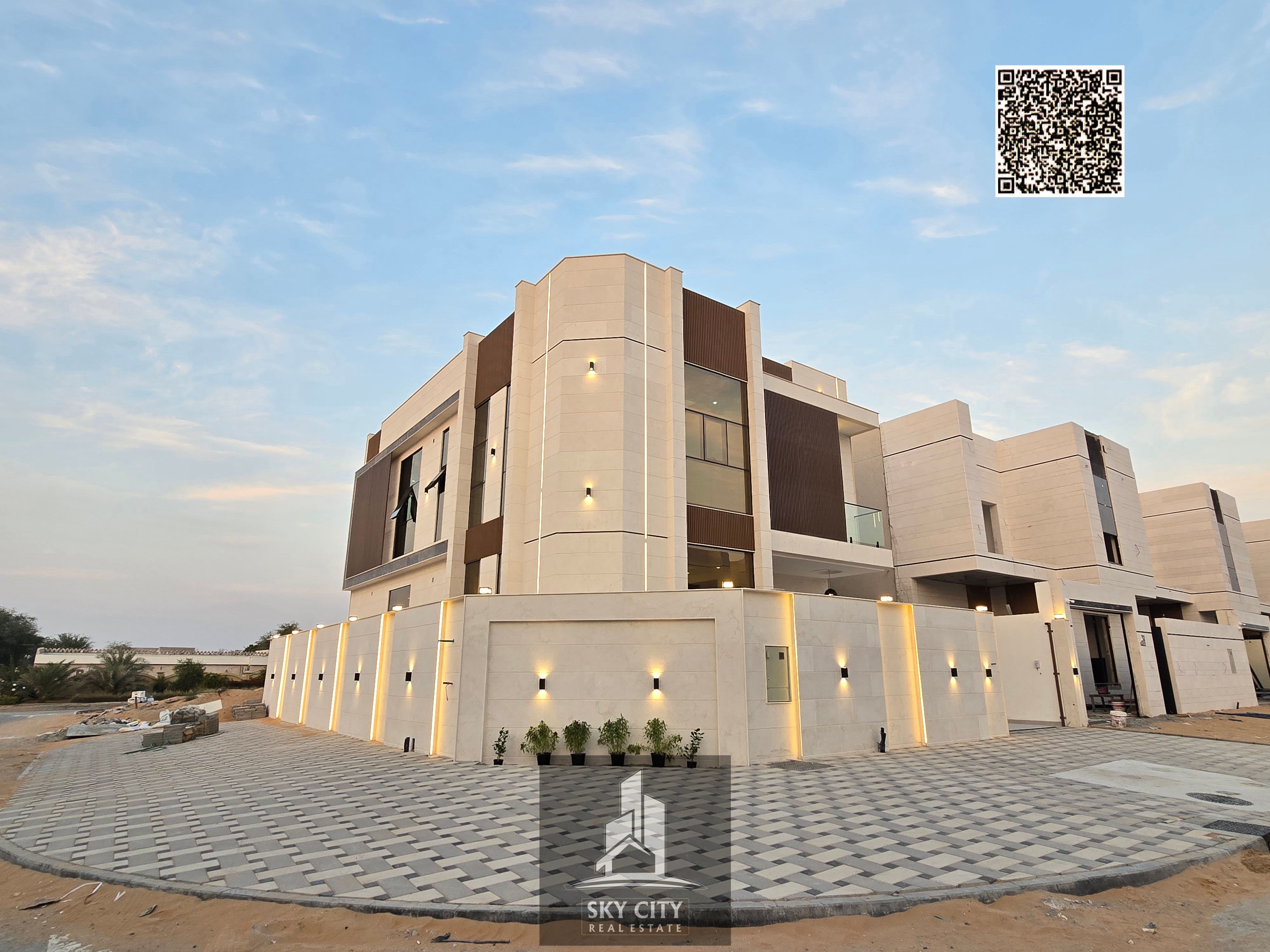 For sale: Corner villa, ground floor, first floor and roof, near the mosque, behind the Emirates Towers