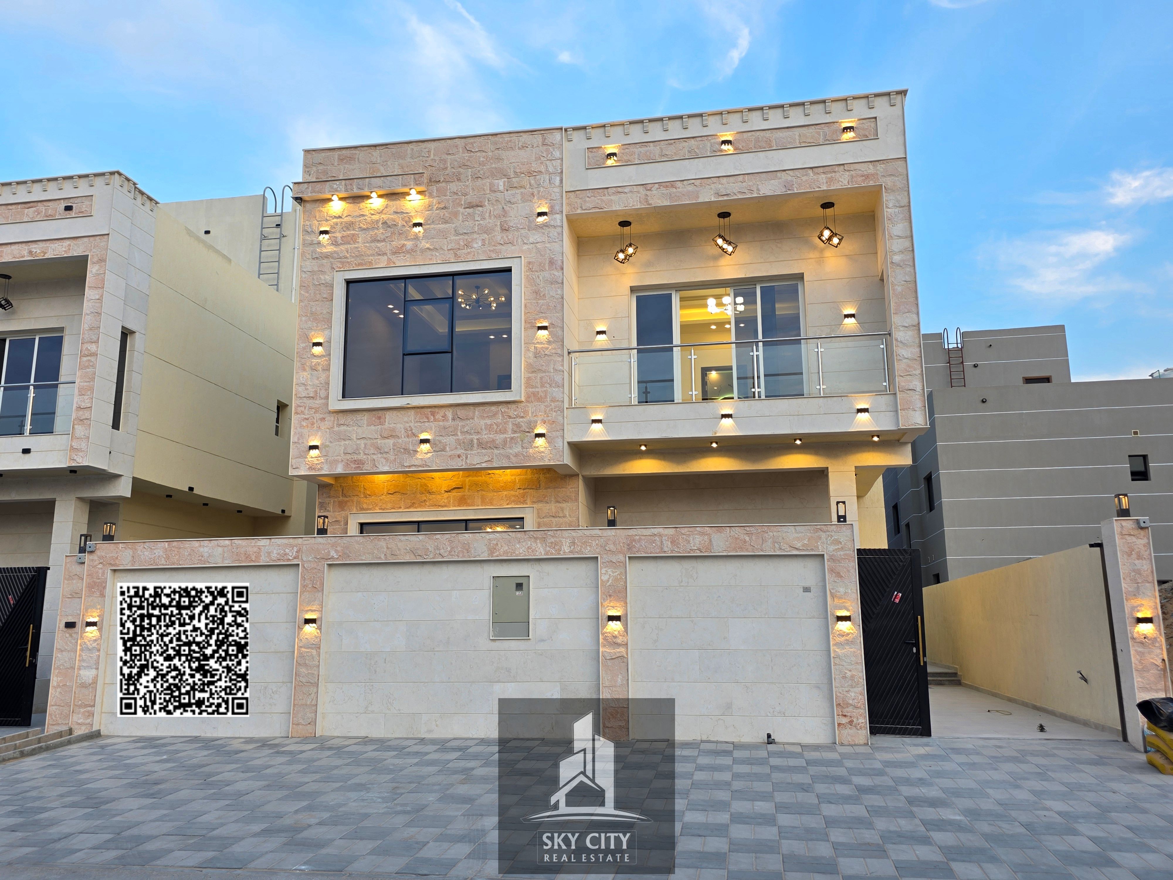 Private villa for sale with the most beautiful view in Ajman, directly overlooking a garden, with a rooftop and swimming pool.