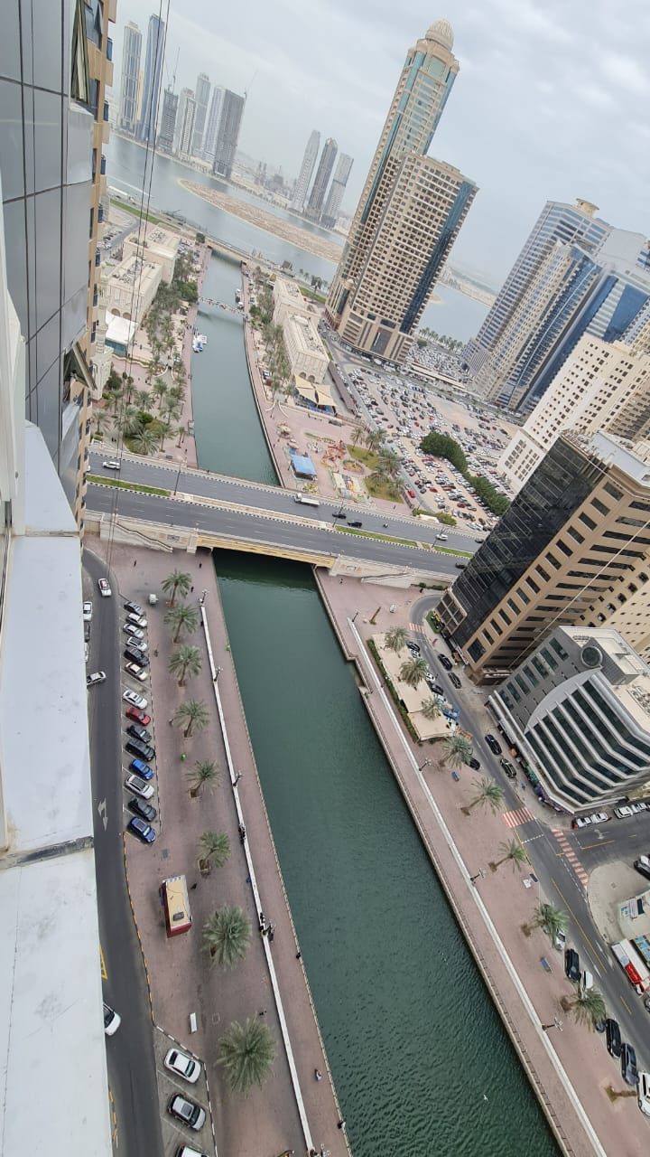 In Al Qasba – Queen Tower – 3-bedroom apartment with a living room, 3 bathrooms, and free parking