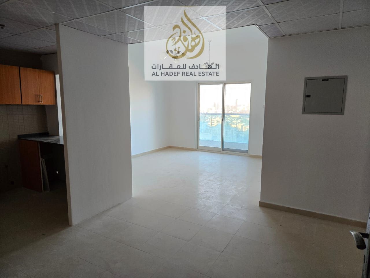 Annual rent in Ajman, Al Nuaimiya 3 area, opposite Grand Mall and next to Al Safeer Mall, City Towers. Two-bedroom apartment with a living room and ba