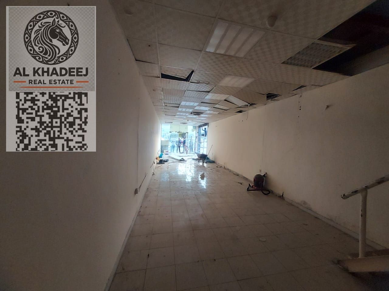 Annual commercial shop for rent in Ajman – Al Rashidiya 1, prime location on a main road near Pearl Towers, suitable for all commercial activities.