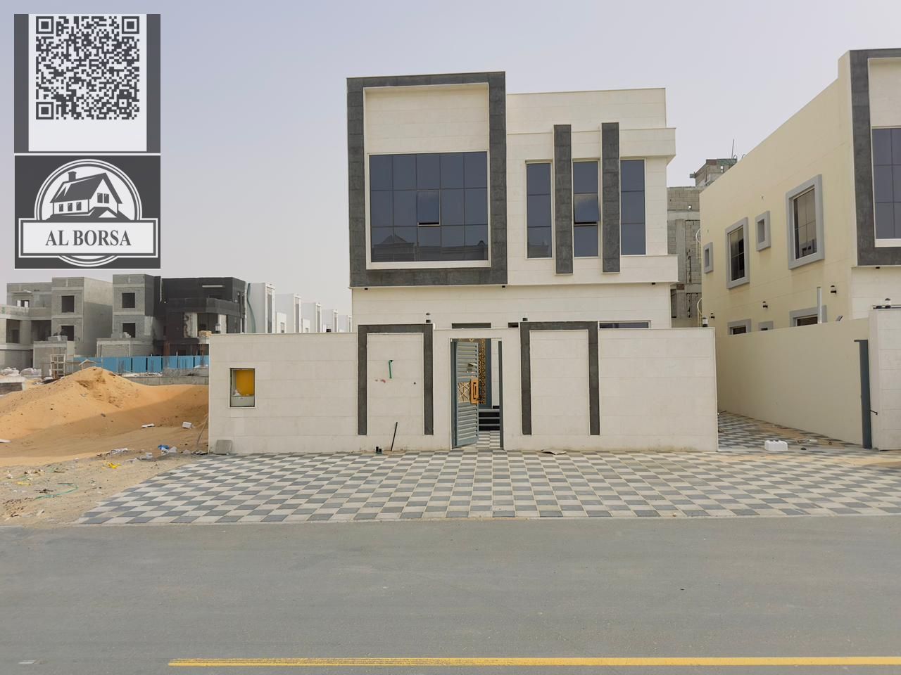 For sale a villa in Al Helio 2 in Ajman, 5 master bedrooms, a majlis, a hall, a maid's room, and a store