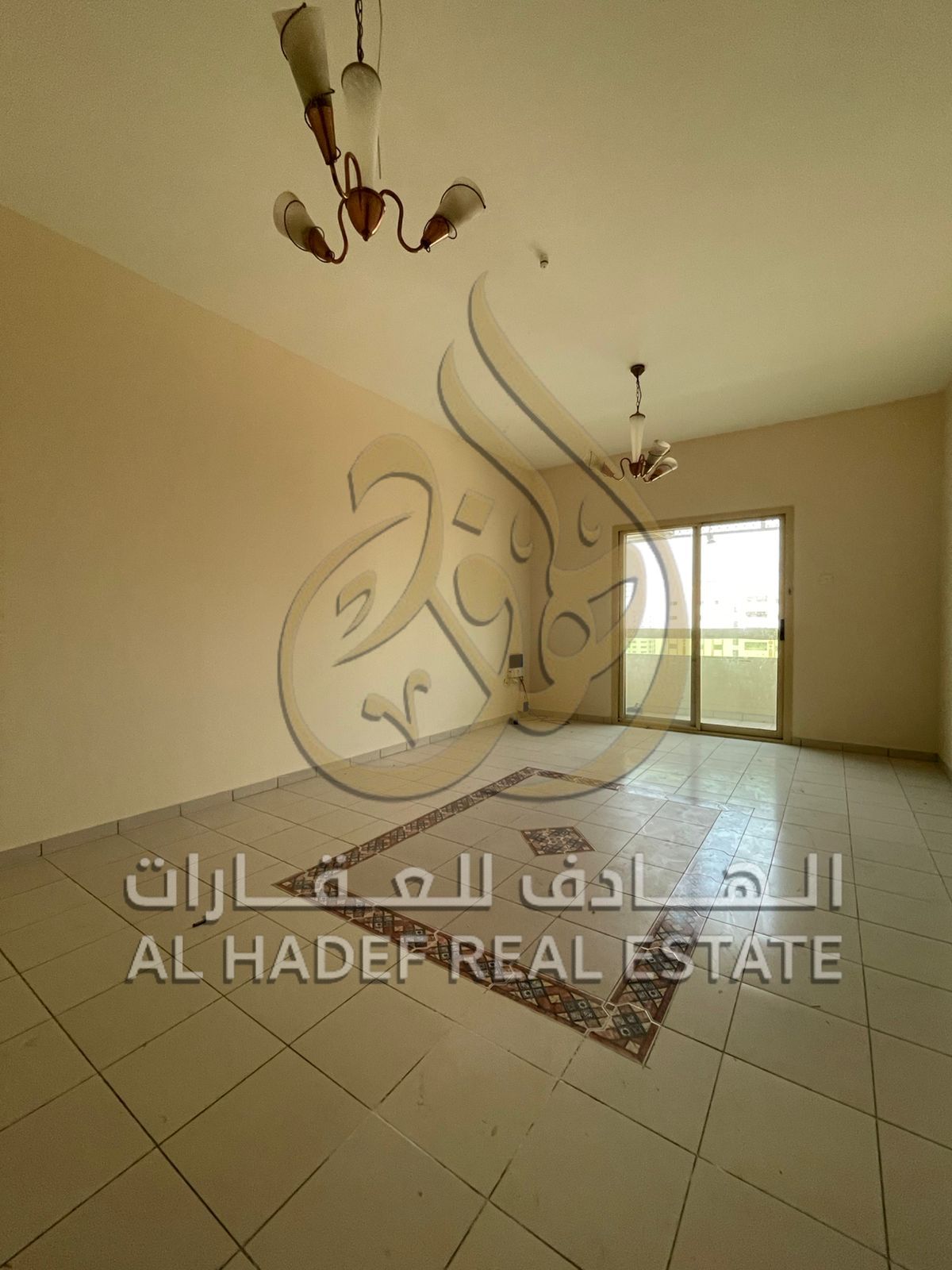 Two-bedroom apartment with a living room — excellent location in Al Qasimia, suitable for families, with maintenance provided by the owner.