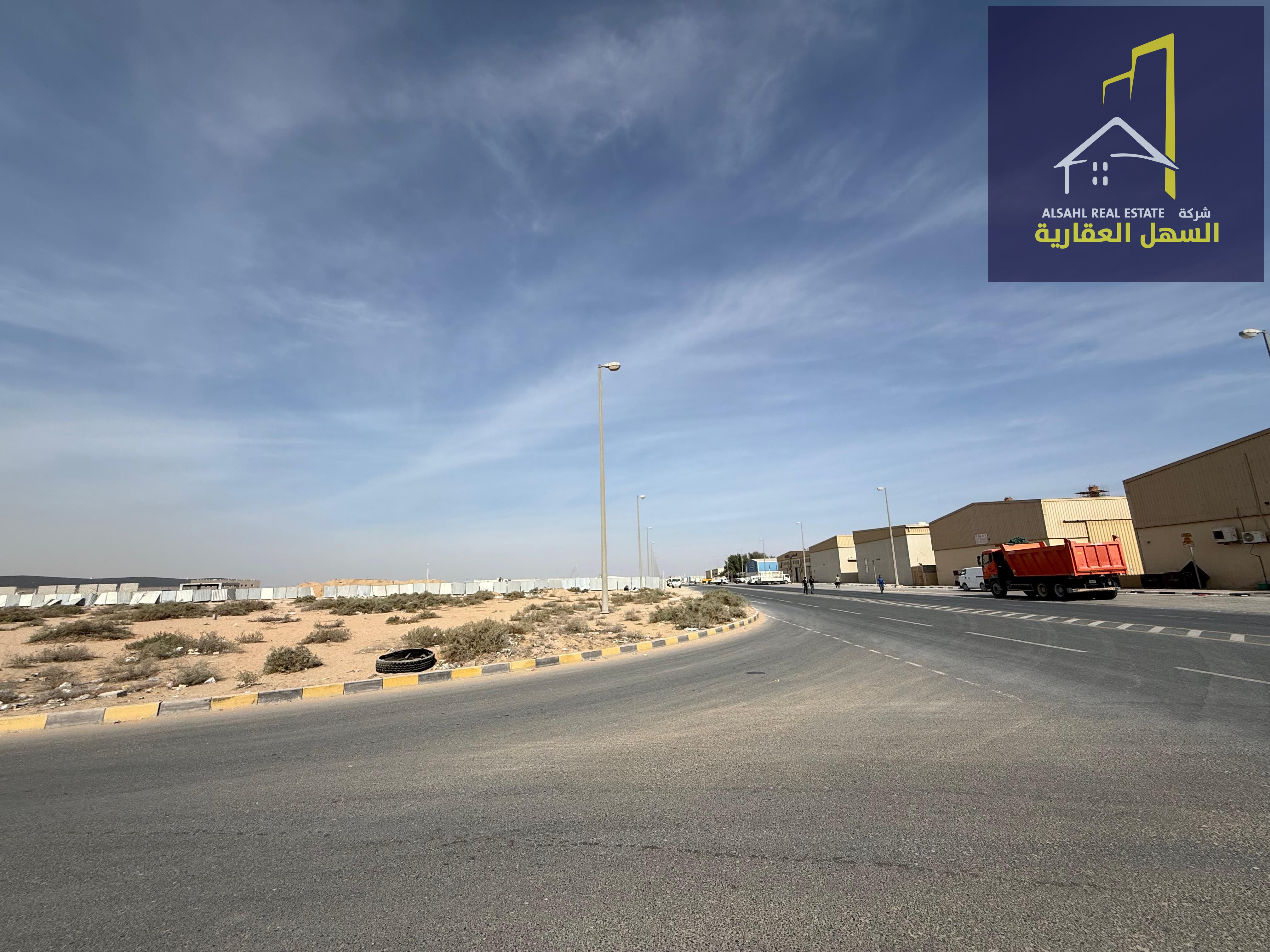 Land for sale in Al Sajaa area, Madinat Al Emarat, Block 2, corner plot on a main street