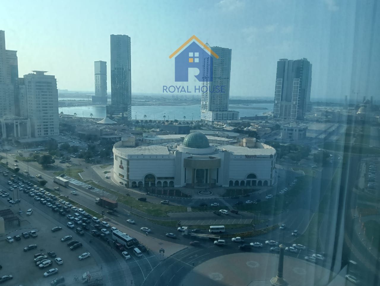 Charming 2 BR in Al Taawun: Serene Living by the Water