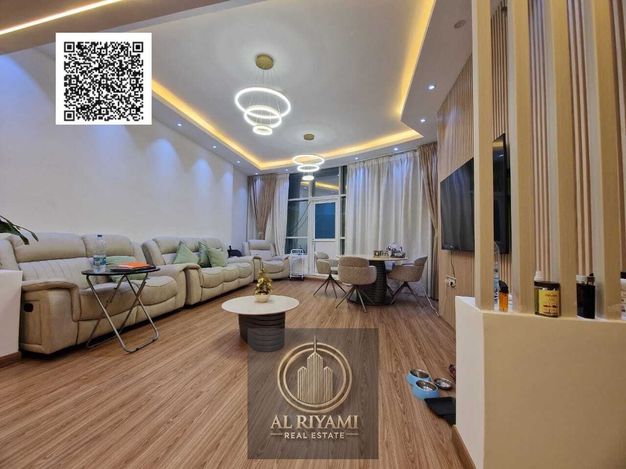 Own now a luxurious two-bedroom apartment with a terrace and panoramic views of Ajman Creek