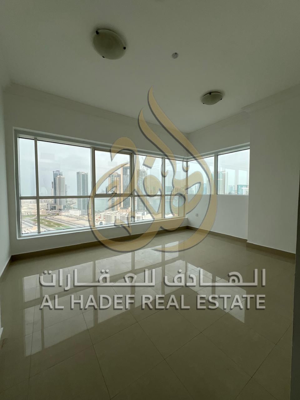 For rent in Sharjah, Al Taawun area — 3 bedrooms and a living room, annual rent, maid's room — balcony with an open view