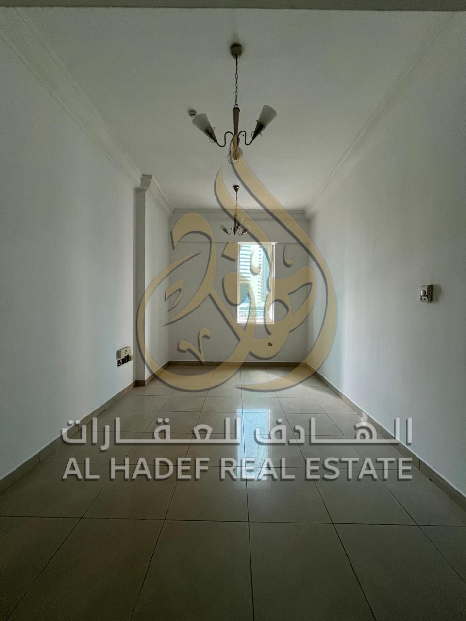 For rent in Sharjah, Al Taawun area — One bedroom and living room, annual fee, free gym, free swimming pool