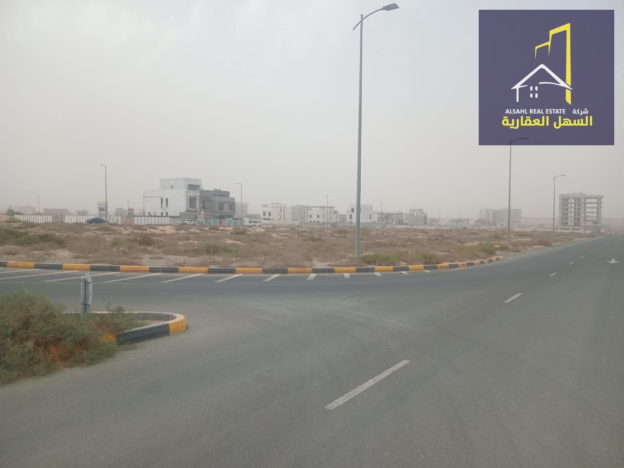 Residential/commercial land for sale in Sharjah Hills area, with a permit for a residential building.