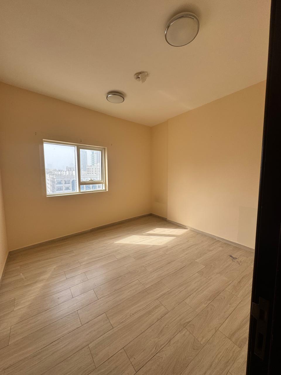 **Two-bedroom apartment with a living room – Second occupant in Al Qasimia Al-Nad – Free parking**
