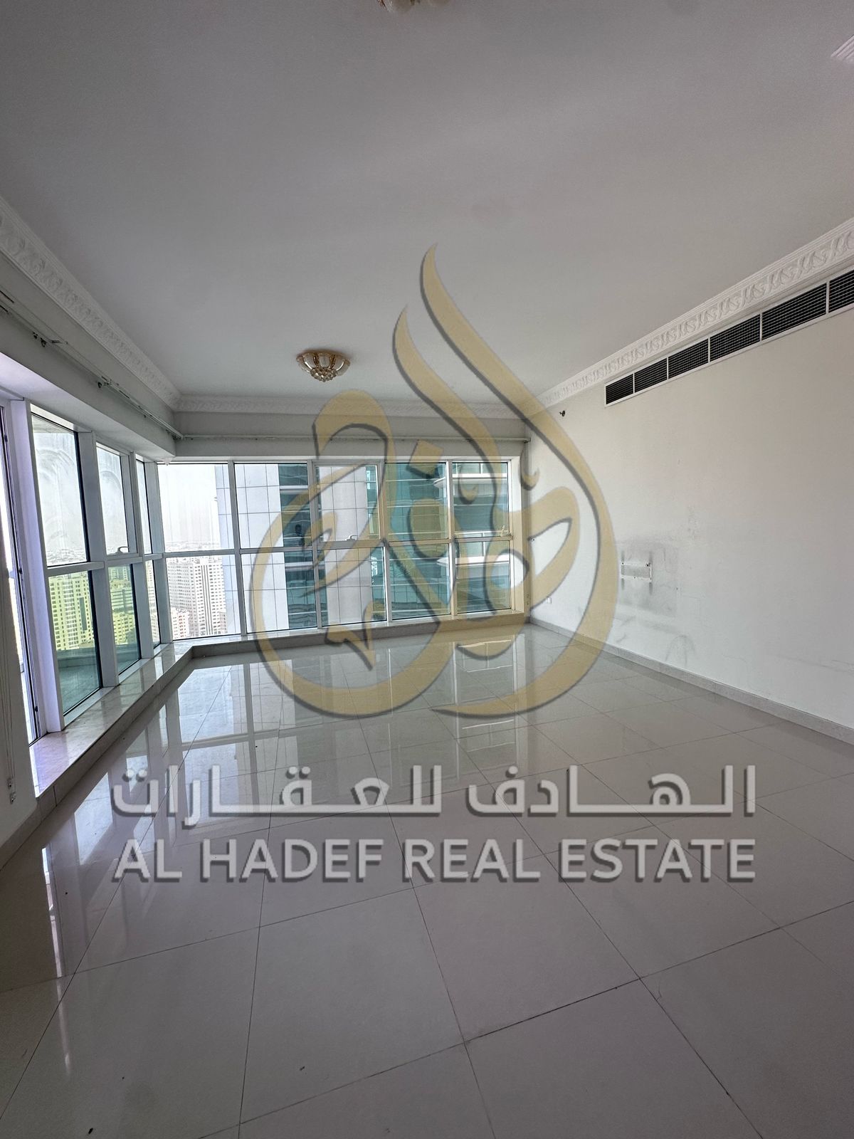 For rent in Sharjah, Al Qasimia area — a two-bedroom apartment with a living room, maid's room, free parking, and a children's play area.