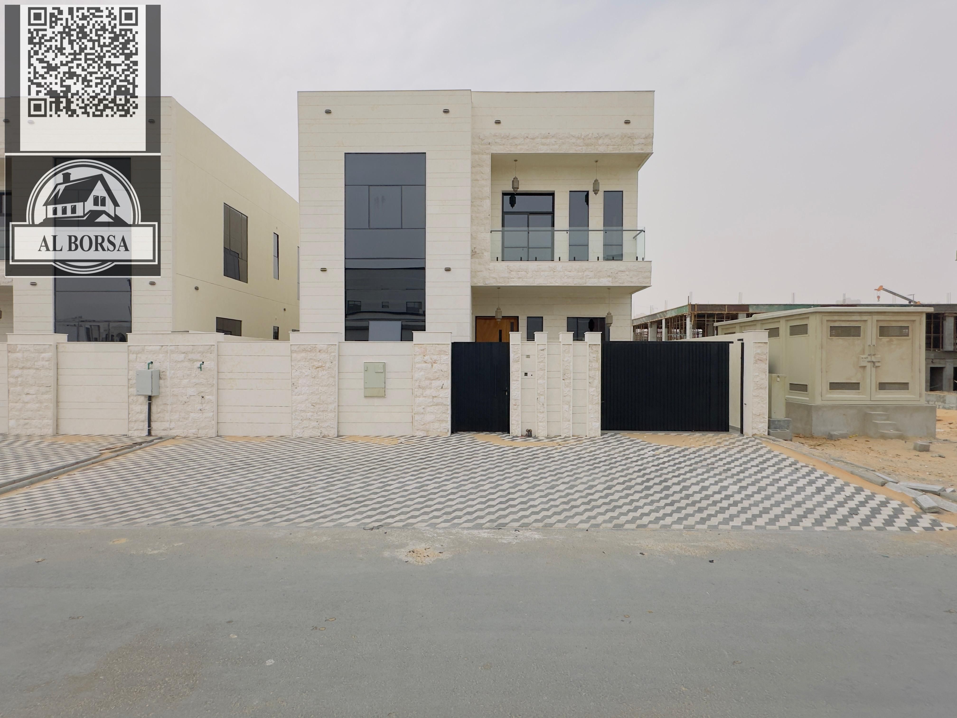 For sale a villa in Al Helio 2 in Ajman, 5 master bedrooms, a majlis, a hall, a maid's room, and a store