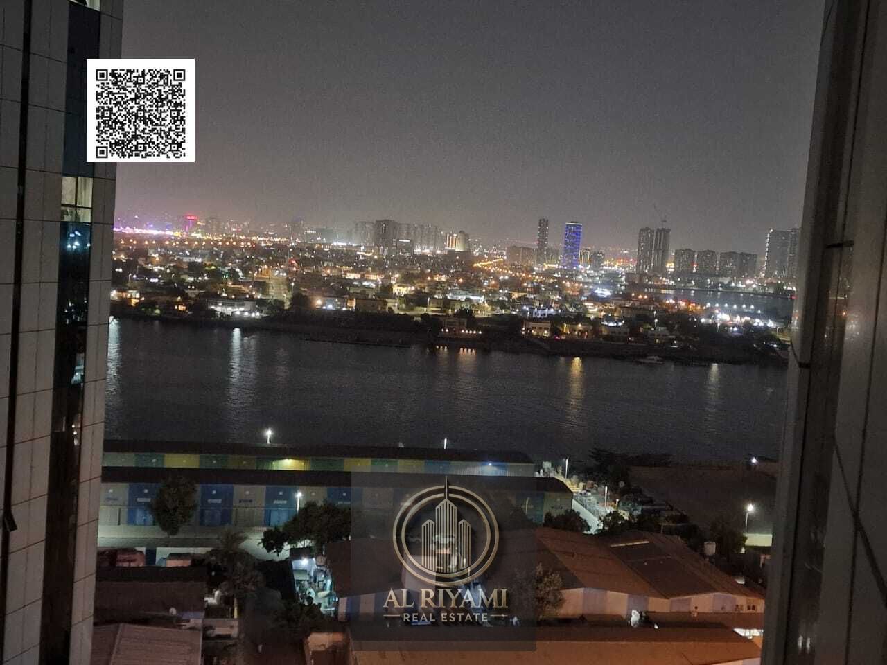 Own a two-bedroom apartment with an open view of Ajman Creek in the Orient Towers