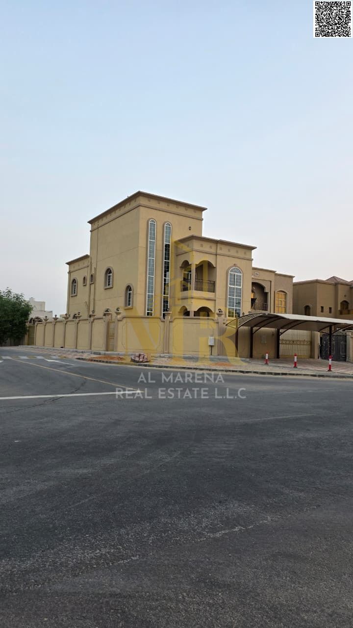 Luxury corner villa in Al Muwaihat 1, Ajman | Two floors and a roof | 8 master bedrooms, 3 kitchens, and an external annex. Price includes electricity