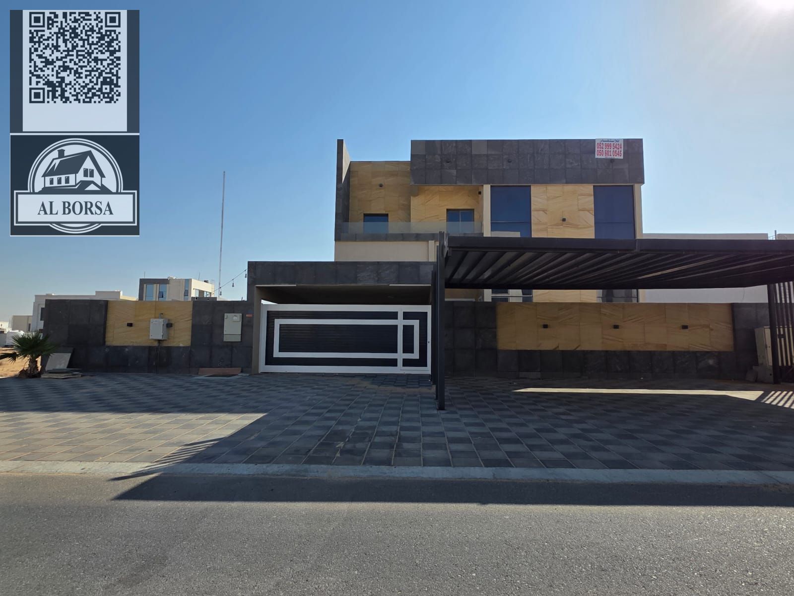 For SALE a villa in Al Helio 2 in Ajman, 5 master bedrooms, a majlis, a hall, a maid's room, and a store