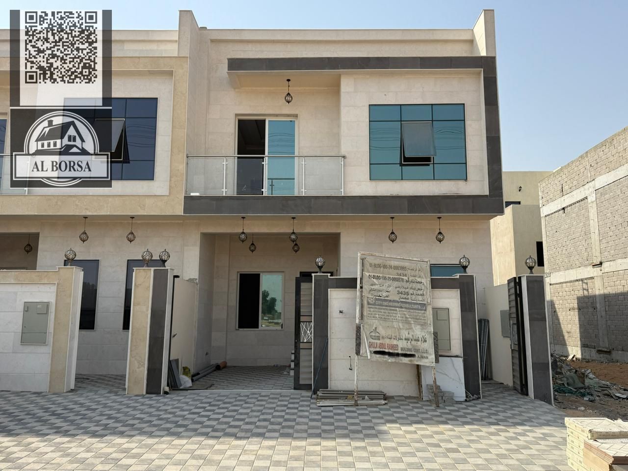 For SALE a villa in Al Helio 2 in Ajman, 5 master bedrooms, a majlis, a hall, a maid's room, and a store