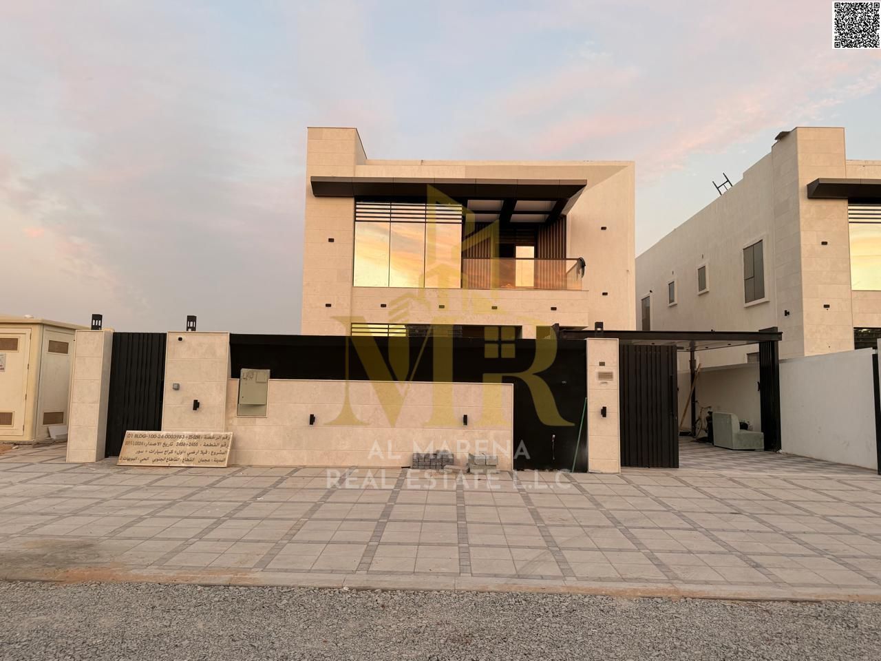 A luxurious villa with stunning architectural design, located opposite Ajman Academy and next to a mosque - modern elegance is clearly evident through