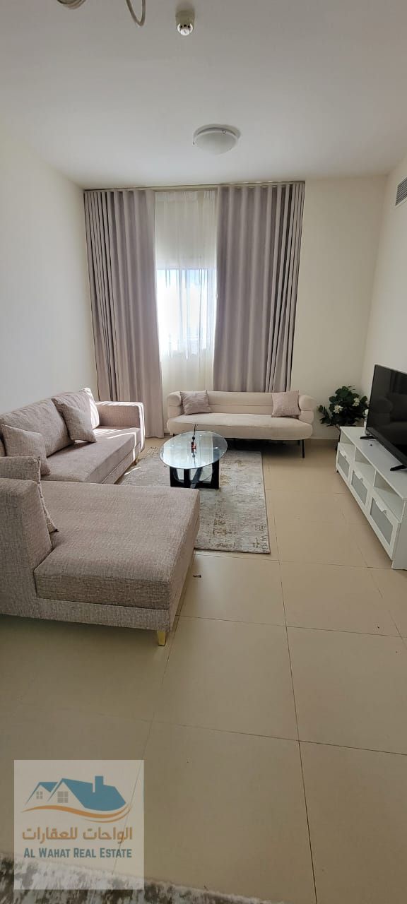 Available for monthly rent in Ajman-Al-Jarf 2, with a hall and a hall, furnished with a walnut carpet, including bills, internet and car parking.