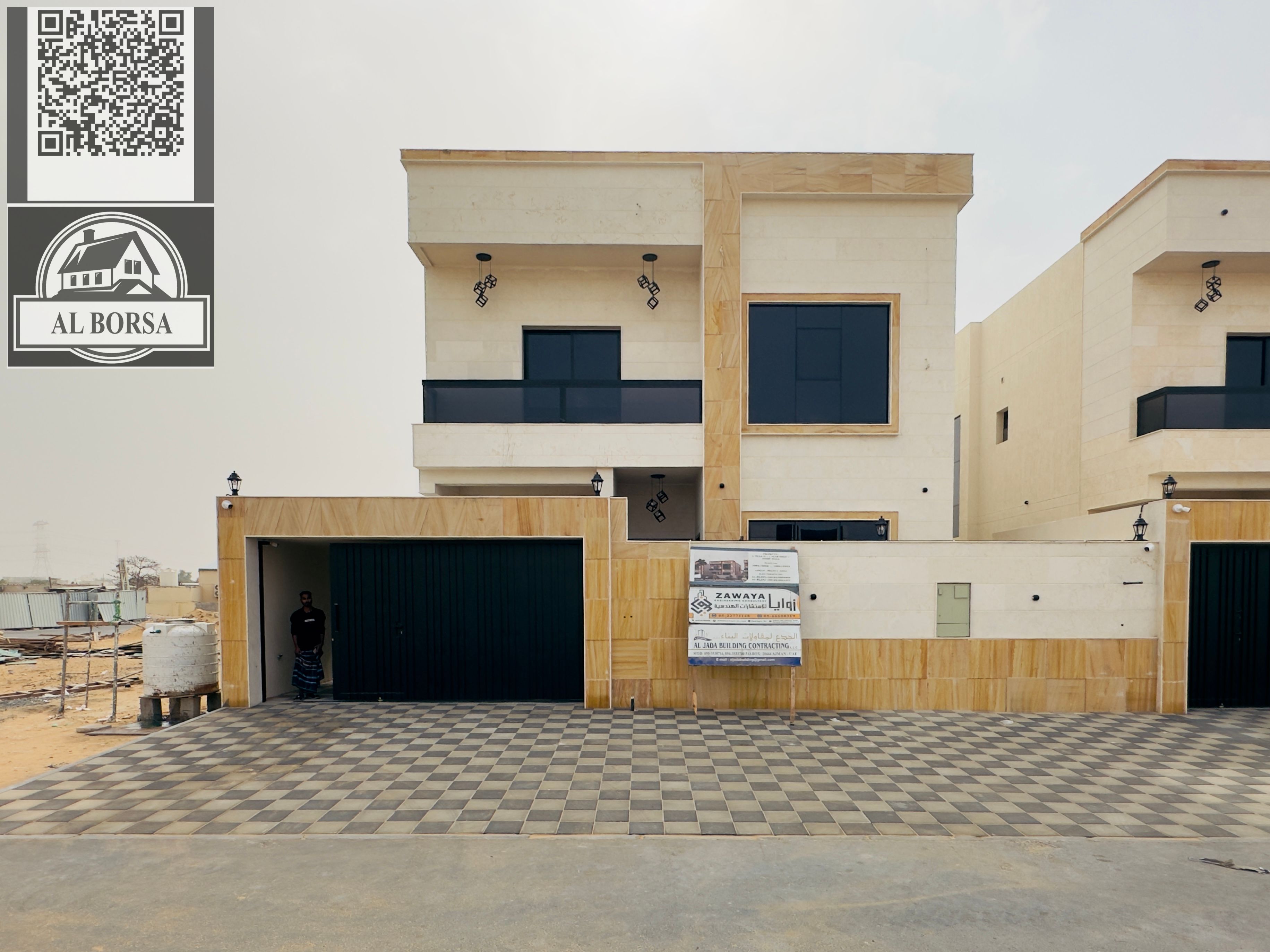 For sale a villa in Al Helio 2 in Ajman, 5 master bedrooms, a majlis, a hall, a maid's room, and a store