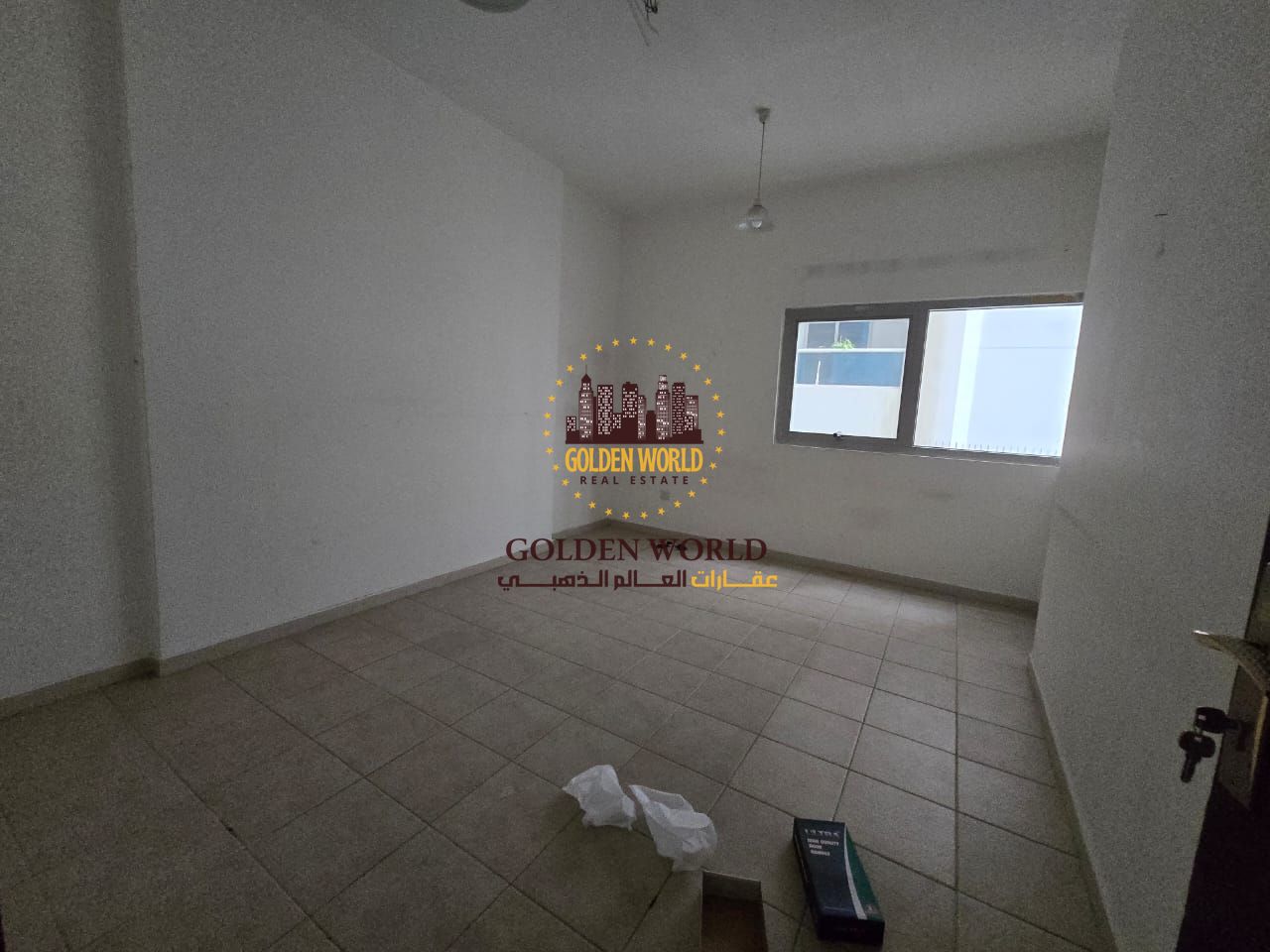Two-bedroom apartment in Al Qasimia Al Nad with balcony, open view, two bathrooms, clean building, fully maintained.