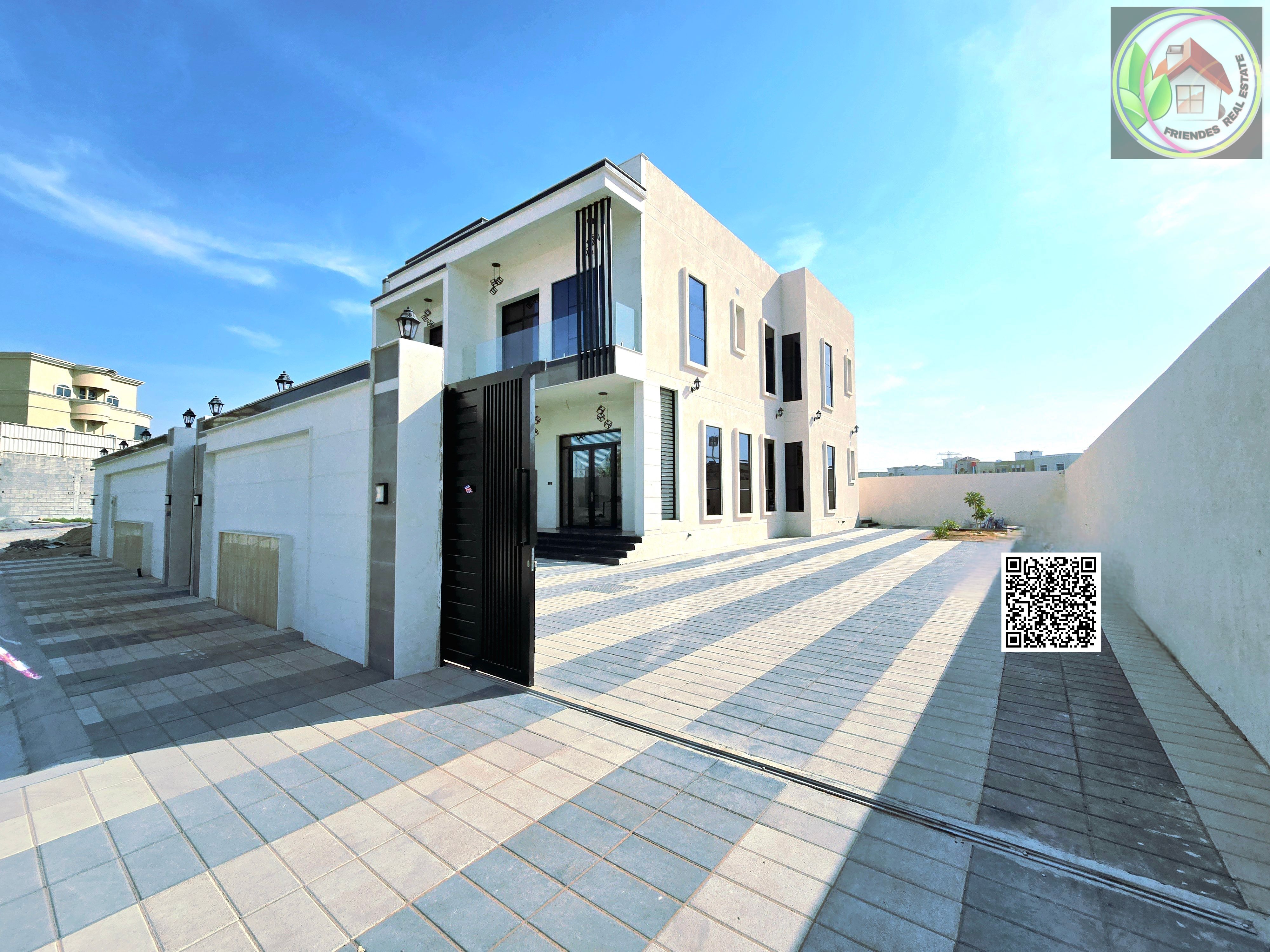 Opposite Al Rahmaniya, Sharjah, a large corner plot with two floors and a roof is for sale. Central air conditioning, electricity and water included. No fees.