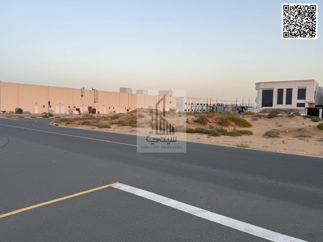 Commercial land for sale on Sheikh Mohammed Bin Zayed Road, permit for ground floor and two floors, at the entrance to Al Zahia.