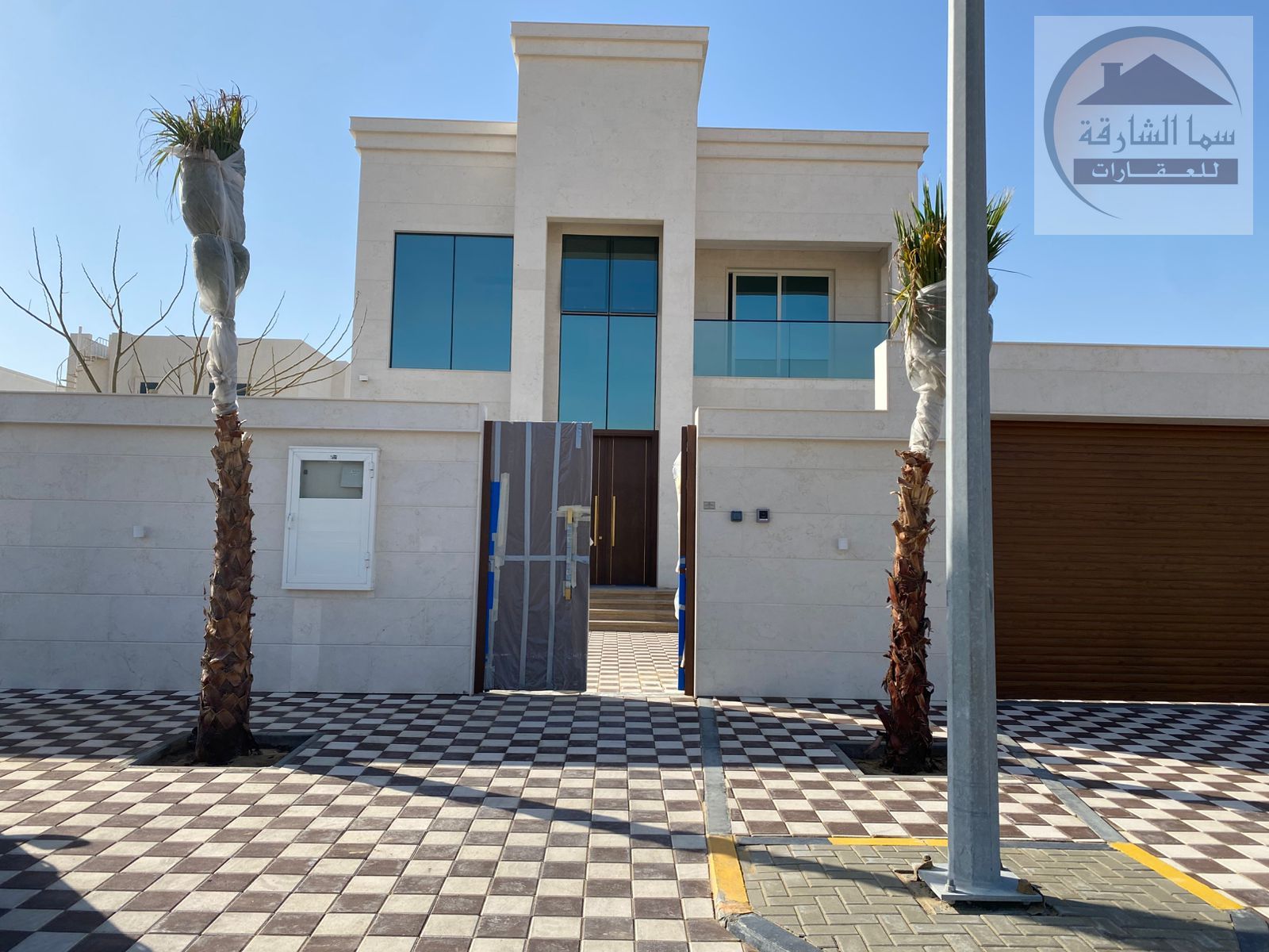 A 6500 sq ft villa with a courtyard and swimming pool, located in a prime location opposite palaces and on a 24-meter wide street, featuring custom fi
