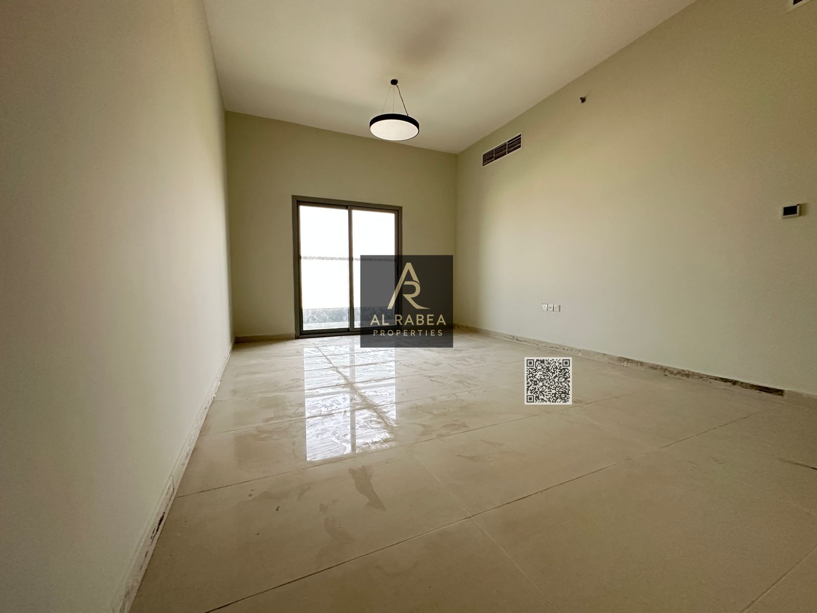 Two-bedroom apartment in Al Jurf 2, behind City Centre Ajman, with central air conditioning.