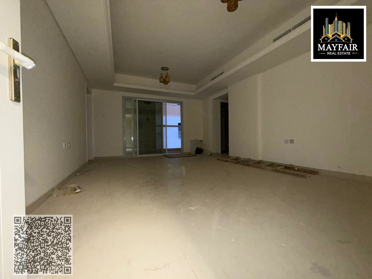 Spacious one-bedroom apartment with a living room and a balcony in a prime location in Al Muwaikhat 3