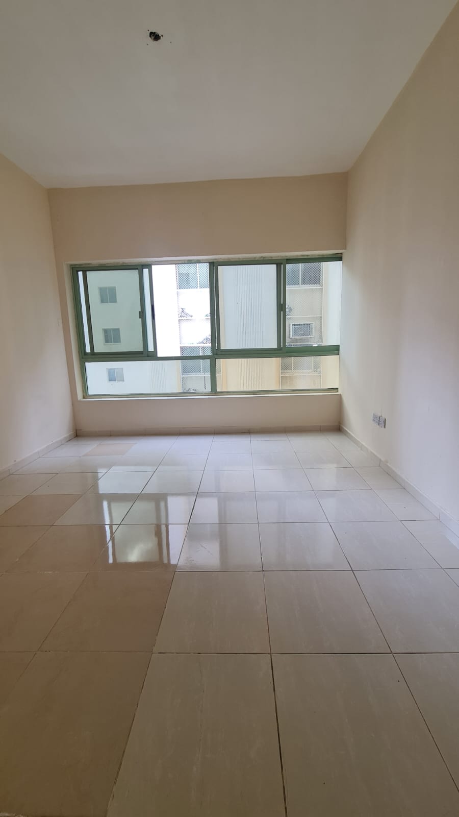 One bedroom and living room in Al Shuwaheen, spacious areas, balcony, payment facilities, prime location and close to services, 24,000 AED.