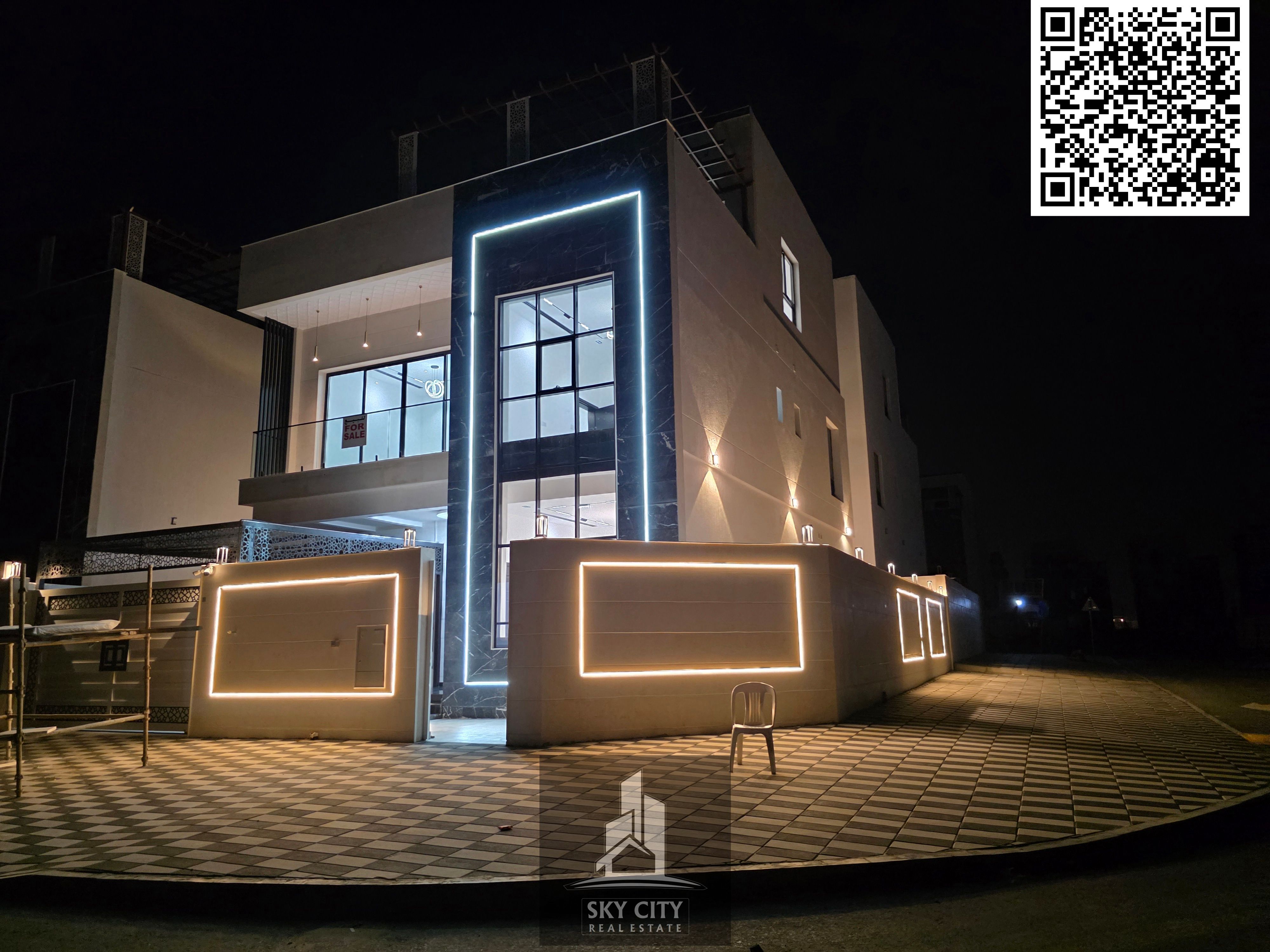 Al-Haliyo, Ajman, behind Emirates Towers on Sheikh Mohammed Bin Zayed Road. 7 master bedrooms, living room, majlis, maid's room, central air conditioning, ground floor, first floor, and roof. Includes registration and ownership fees.