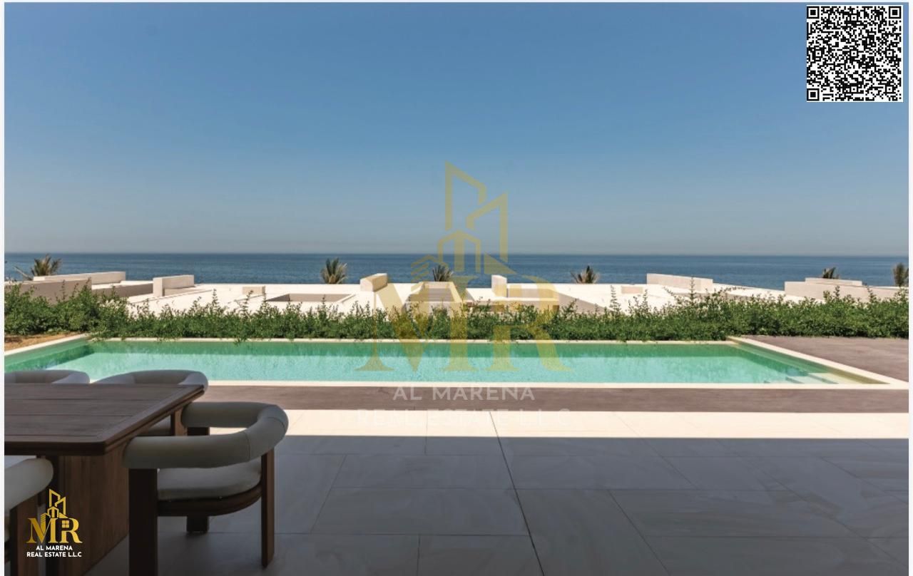 Villa with direct view of Al Zorah Beach, 10,580 sq ft, 4 master bedrooms, living room and modern kitchen, prime location, price includes electricity,