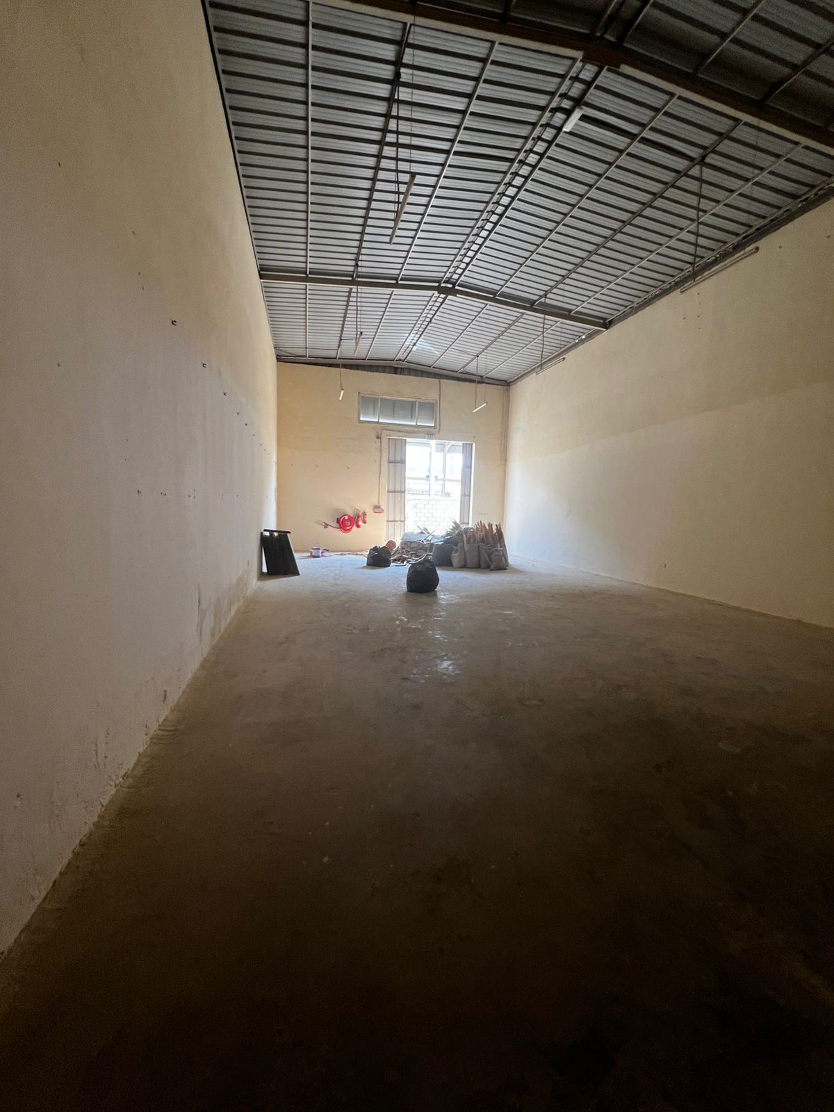 Warehouse for rent in Umm Al Quwain, suitable for storage and manufacturing, 2,500 sq ft with 25 kW electricity.