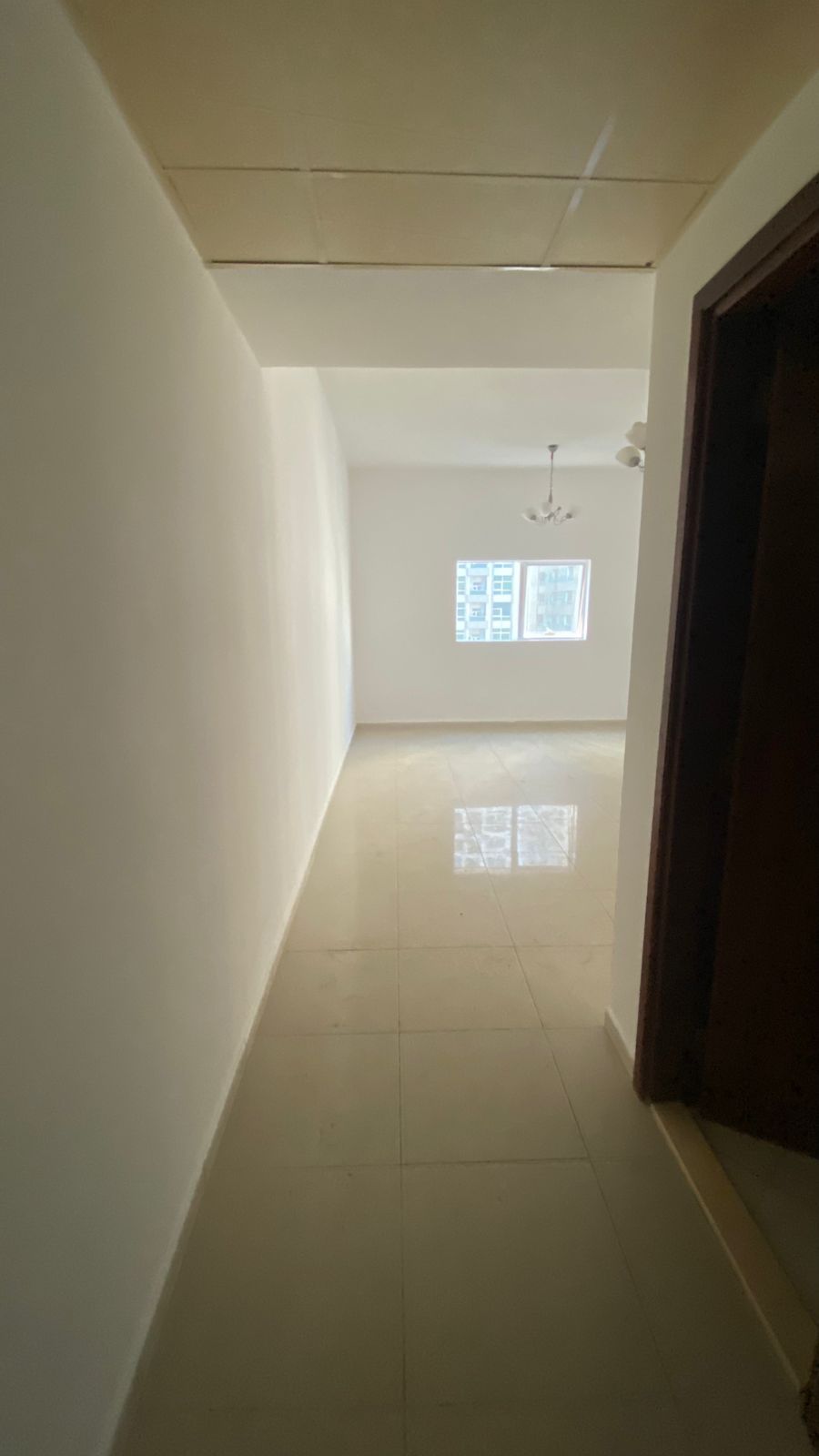 One bedroom and living room with balcony, spacious areas, no deposit, payment facilities, prime location, ready to move in, 35,000 AED.